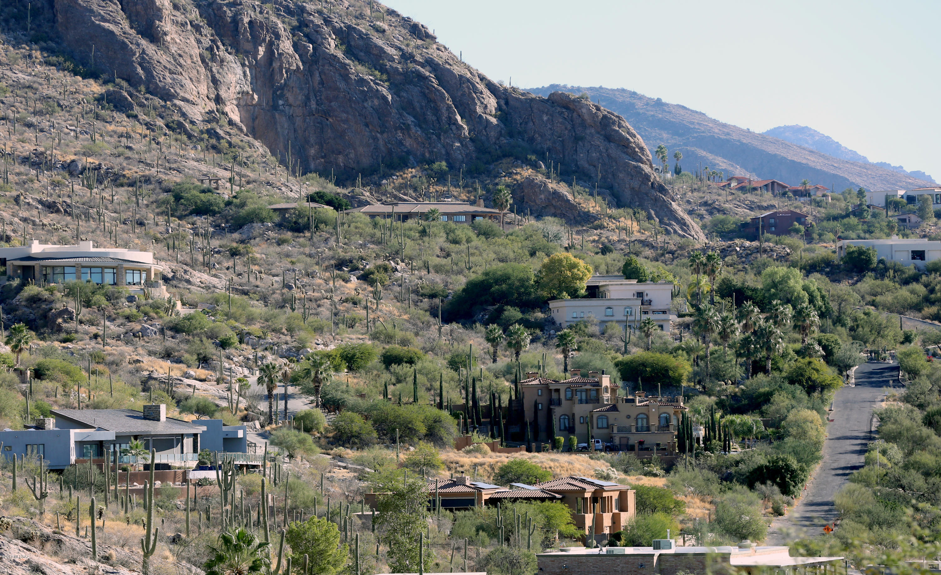 Extraordinary lot with breathtaking mountain and Tucson city views from the top of Swan Rd.  Enjoy 360 degree jaw-dropping views from within the exclusive gated community, Summit, located close to La Paloma and Skyline Country Club.  If you have been looking to build your dream home with spectacular views to match, this is the lot for you.  Seller will carry-back 1 year with no interest!