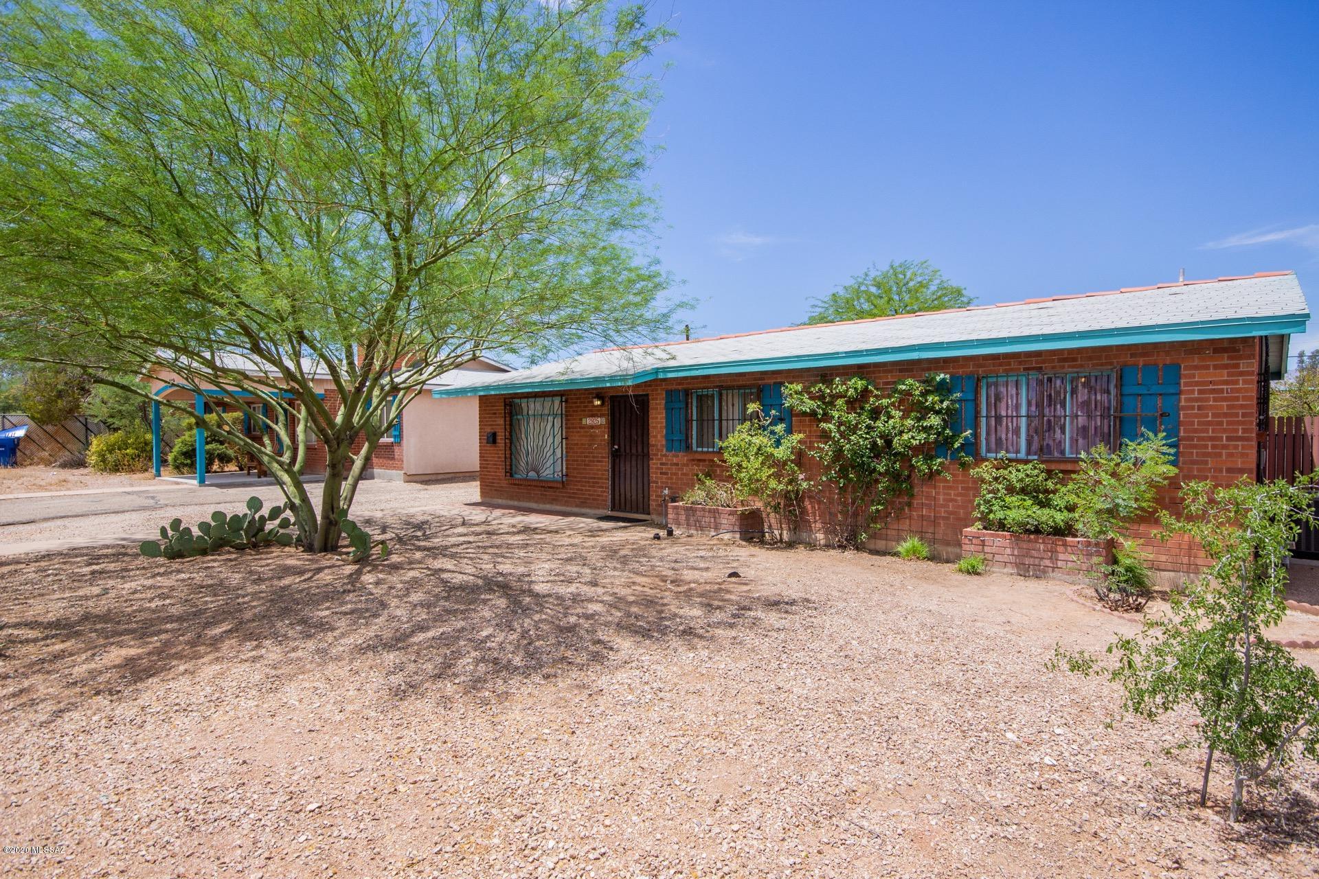 Brand new energy efficient AC Unit with transferable warranty, No HOA! Charming brick home w/mature landscape in a well established central neighborhood. Open floor plan, neutral tiled floor, custom palette, ceiling fans, & dining area, w/patio access. Plenty of wood kitchen cabinets & counter space. Handsome engineered wood floors in 2 bedrooms, carpet in the 3rd bedroom, large closets, & 2 baths. Enjoy the backyard covered patio & fire pit area. The detached garage/workshop is a huge plus with direct access from the alley. . Fall in love with all its charm!