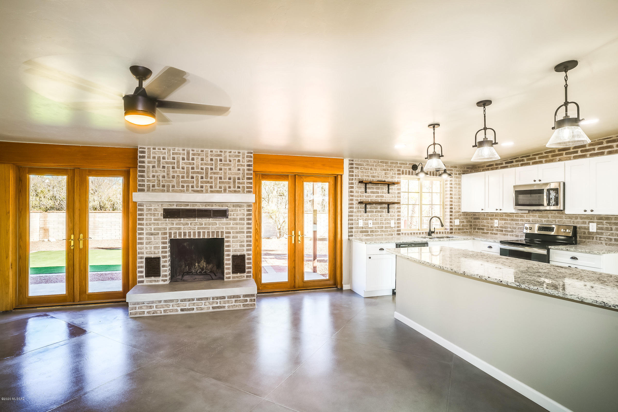 Wonderful remodeled home in an awesome enclave nestled into the Tanque Verde valley. Spectacular home loaded with character and charm.  This 1970 burnt adobe is located on an elevated lot with mountain views, beautifully landscaped yard and sparkling pool. You will love this beautiful 3/2 bath home featuring an open floor plan, new kitchen with granite counter tops, concrete floors and exquisite updated bathrooms. New windows, newer roof, AC with gas furnace  and all new fixtures and lighting.