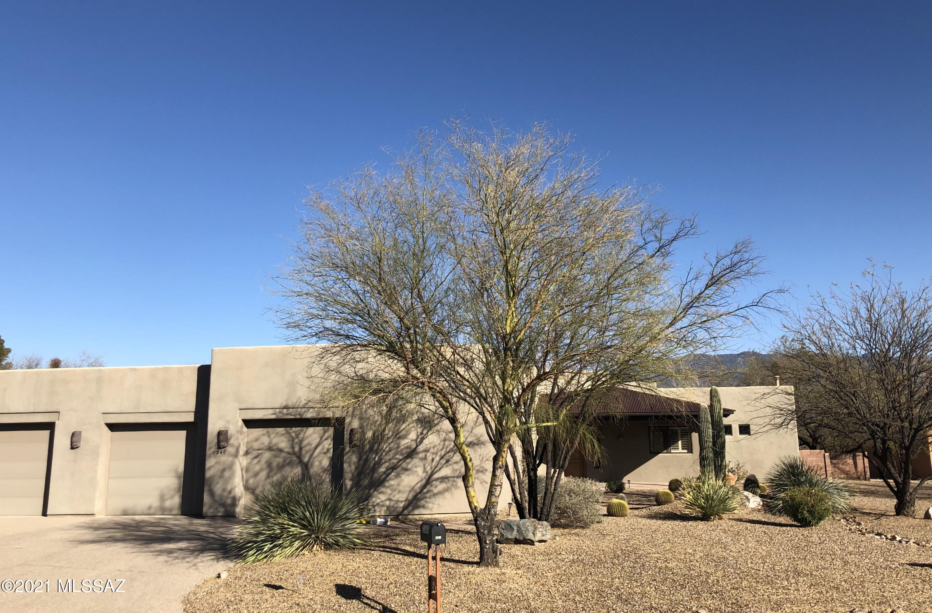 This beautiful home is designed for Tucson living --- quiet and private in gated subdivision of only 9 homes. Positioned on .88 acre lot providing views of the Rincon mountains with their spectacular sunrises from two of three covered patios, the pool and spa (with high-functioning remote control), great room, master bedroom, kitchen and breakfast nook. Bring your BBQ -- the side patio has a gas stub. The front covered patio offers a view of the manicured front desert plantings and on to stunning sunsets. The open floor plan of the home is light and bright with soaring ceilings, expansive windows and deep, dramatic skylights. The split bedroom plan offers a master suite complete with its own personal ''retreat'' ... (reading room?, exercise room?); its bathroom has two separate vanities, garden tub, large shower and an incredibly large walk-in closet. Two roomy guest rooms share a Jack and Jill bath which includes two sinks. The fourth bedroom is positioned next to its own full bathroom, creating a perfect guest suite. A powder room is adjacent to the Great Room. The kitchen is positioned to watch over the great room, breakfast nook and formal dining room. It boasts a 10' island, walk-in pantry, granite slab counters, under-cabinet lighting, 42" cherry cabinets w/pull-out shelving and GE Profile appliances. The dining room is dramatic with a stunning coved ceiling. The 3-car garage has 2 huge storage rooms.