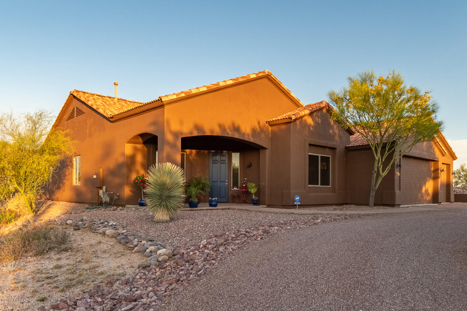 PRICE REDUCTION! Views of red sunsets reflect off the panoramic Catalina mountains, bathing the pool, patio and Great Room of this beautiful, open, made-for-Tucson home. Amenities too numerous for this space include natural Hickory cabinetry with under-cabinet lighting, over 750 sq ft garage, loads of storage, crown molding and coffer ceilings, new exterior paint, and Bose surround sound on 3.34 acres. (all amenities can be viewed under Additional Documents). Currently, the home is occupied as three bedrooms, with a den and a Living Room/Library with full light French doors. Either room can be converted easily to a fourth bedroom or guest room. Kitchen/Great Room/Terraced ''Resort'' Patio is a wonderful  area inviting a gathering or just quiet enjoyment of those unobstructed mountain viewS Tho no facilities, property is zoned for horses too!