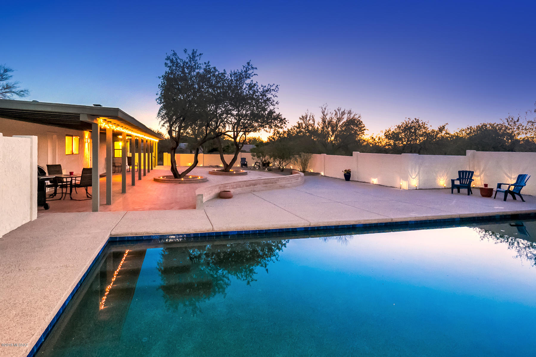 Welcome Home to your Oasis in the Desert!  This Spacious 4 Bd/3Ba home exudes charm with it's Saltillo Tile Floors, Open Floor Plan, Fireplaces in both Great Room & Dining Room & Separate Guest Quarters!  The Huge Kitchen has an Island as well as room for a Breakfast Table.  The Spectacular Back Yard has a Covered Patio, Paved Open Patios & Separate Entertainment Areas, Fire Pit, Sparkling, Extra Long Pool for swimming laps.  Cozy Front Courtyard invites you to watch the morning wildlife while Backyard begs for BBQ's and Friends.  Come See!