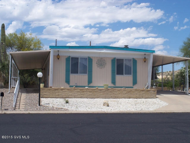 WOW!! Spacious home on large lot with super east facing views. Very light interior. formal dining area. Kitchen with lots of cabinets and newer appliances. Family room with wet bar. Mirrored closet doors in both bedrooms. A/C, furnace and water heater replaced along with vent pipes from A/C and heating unit. HOA dues only $50 month, includes trash pick up once a week, great recreational facilities with heated pool and spa, ceramics,billiard, library, and exercise rooms. Shuffle board, horseshoes and bean bag toss. Agents residents of sub-division, call them to see this property and any others @ 520-625-8862 or 520-241-3466. Furnishings included. Seller may carry with 30% down, 5%, 20 year amortization, with a balloon payment due in 10 years.