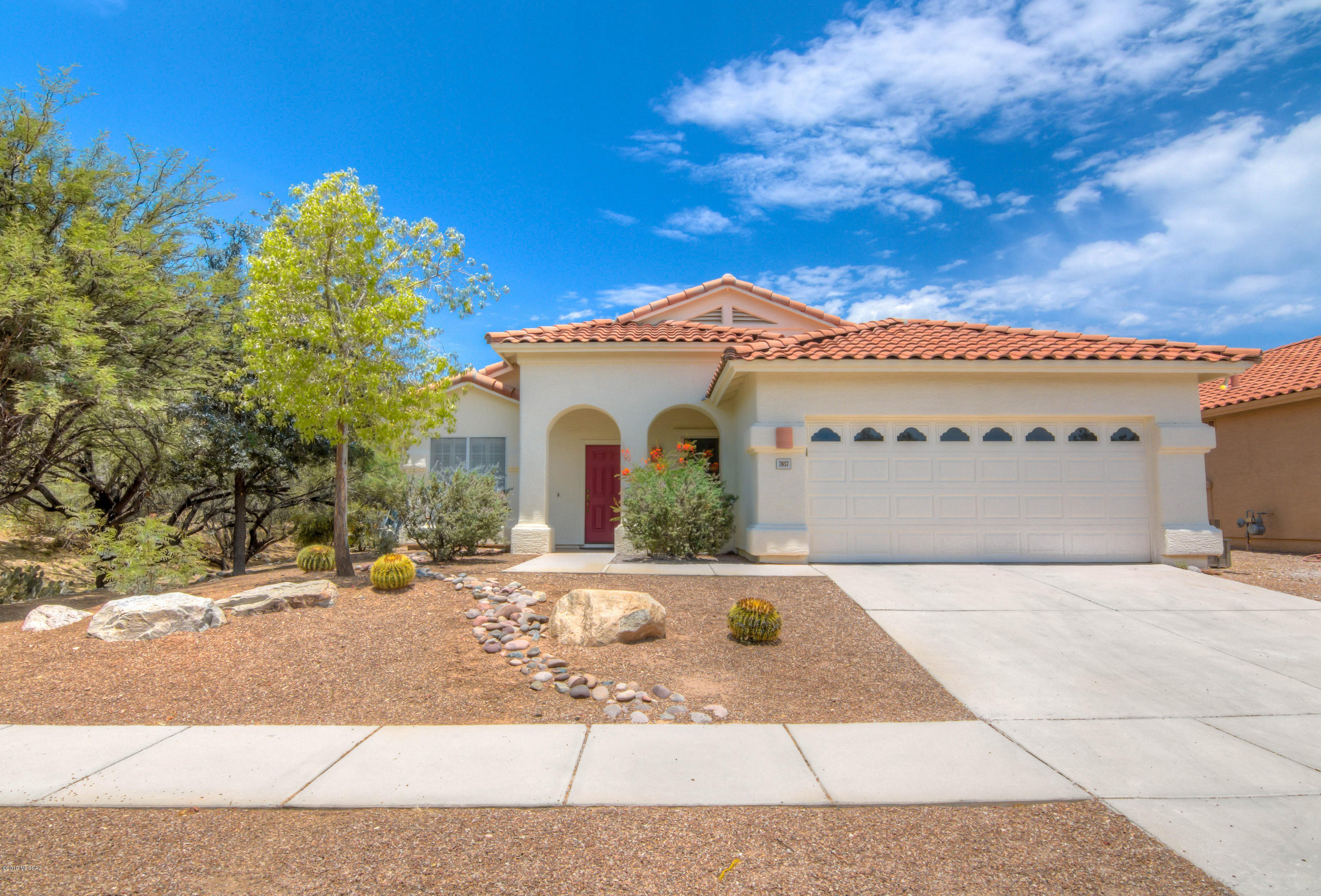 Beautiful Home Near Sabino Canyon with Pool and Spa! Home offers spacious Family Room with cozy gas fireplace, vaulted ceilings, oversized diagonal set tile floors throughout, separate Living Room/Dining Area, plantation shutters, newer AC, instant gas water heater, garage storage cabinets, and much more. Open Kitchen with granite slab counters, stainless appliances, island with breakfast bar, pantry, and bay window dining area. Master Suite has walk-in closet, dual sink vanity, garden tub, and separate shower. Backyard retreat offers large covered patio, refreshing pool and spa with brand new plaster, and painted concrete deck. Lot sides to natural buffer area and is only one block from the Sabino Canyon Recreation Area.