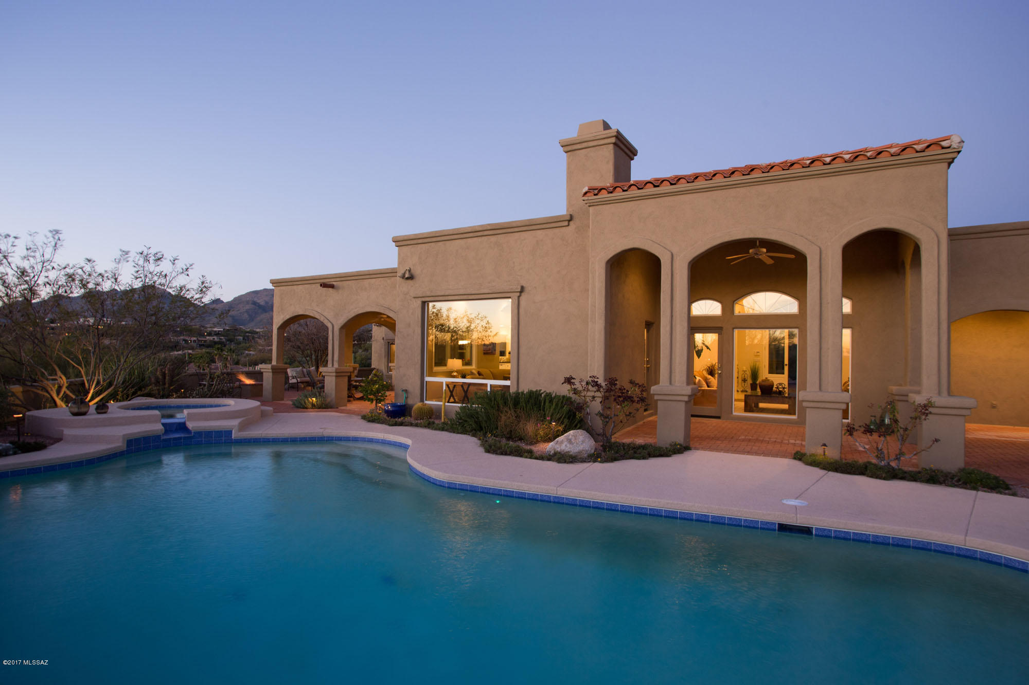 Soft contemporary w/360 views, sited on 2.7 ac hilltop lot. Open floor plan w/ grandly proportioned rooms, all w/city or mtn views. Island kitchen w/newer appliances. Spacious breakfast nook for casual dining. Family room features fireplace w/slate facade. Natural Travertine tile floors, slab granite countertops, high-quality built-ins in dining rm & Br 4. Master retreat w/gas fireplace, bay window alcove & city & mtn vistas. Luxuriously appointed bath & large walk-in California style closet.  Split Br plan w/ J&J baths, plus powder rm w/pool access. Even laundry rm has views! Oversized garage features storage rm & workbench area. Wrap-around porch, extensive patios, lovely pool and spa, all featuring panoramic views.  Don't miss built-in gas bbq and gas fire pit.