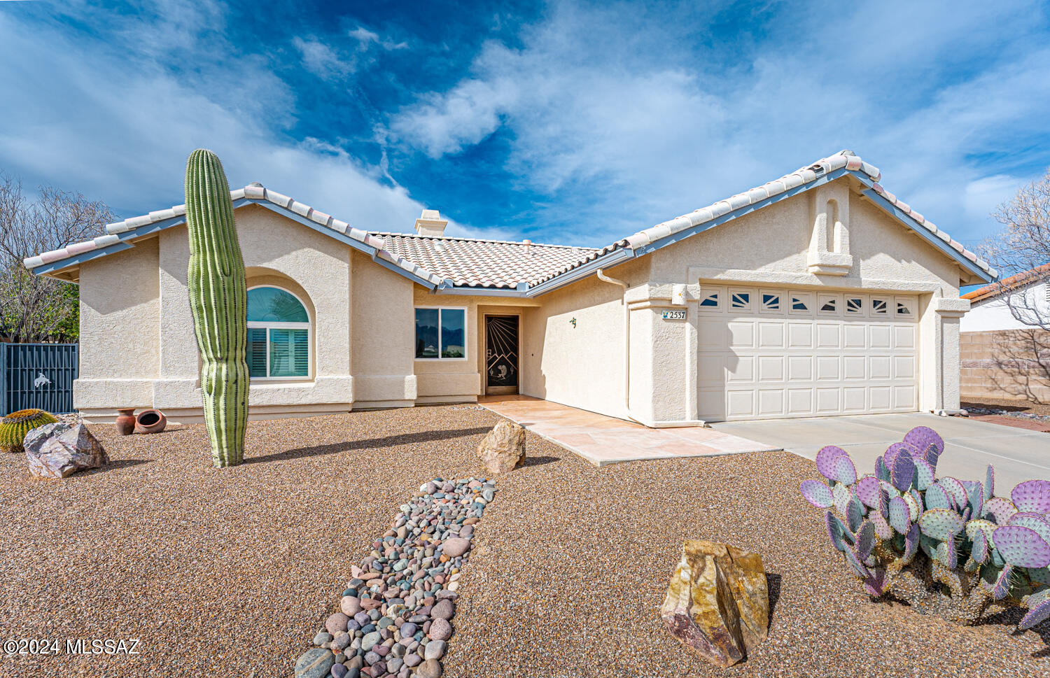 Updated home on large lot in age restricted La Joya Verde HOA.
1666 sq ft.  Great room with fireplace, high ceilings, open to dining area and kitchen with Hickory cabinets, stainless appliances, quartz counters and decorative backsplash. 
Separate large family room with French Doors, and many windows capturing the view of the oversized rear lot with extended patio, built in grill, inviting landscape with fountain and rain harvesting system.  Den with plantation shutters and barn door opening to the desk area.  Ceramic tile in main living areas with wood laminate in bedrooms and den. Epoxy coated extended garage with built in storage cabinets.   Ideal location next to the HOA community center with pool /spa, clubhouse and pickle ball courts.