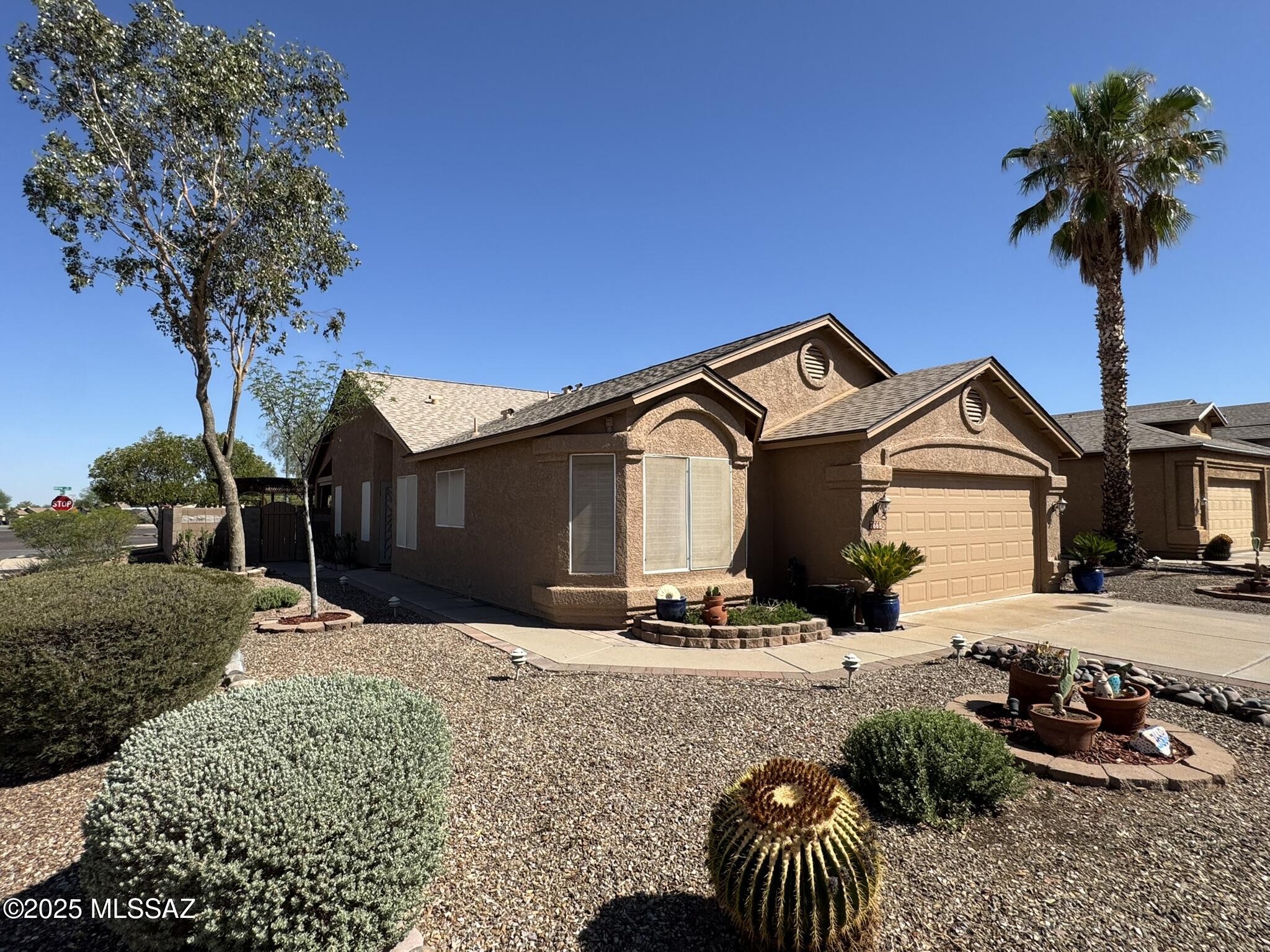 Updated and upgraded Rita Ranch contemporary just waiting for you!  Solid 3 bedroom/2 bath 1569 sf home with vaulted ceilings, new paint in and out and plenty of love.  It has the original owners of 28 years and you can benefit from the upgraded bathrooms, kitchen and fully landscaped backyard!  The bathrooms have jetted tubs, custom tile work and new counters as well as new mirrors in both.  The kitchen has newer cabinets, granite and beautiful stainless steel appliances.  The water heater has been changed out for tankless on demand.  The outside is fully done..just keep it up!  It comes with full length covered patio, pergola, large shed, built-in grill and garden areas.  This home has been meticulously maintained and you can benefit from all the work that has been done! JUST MOVE IN!