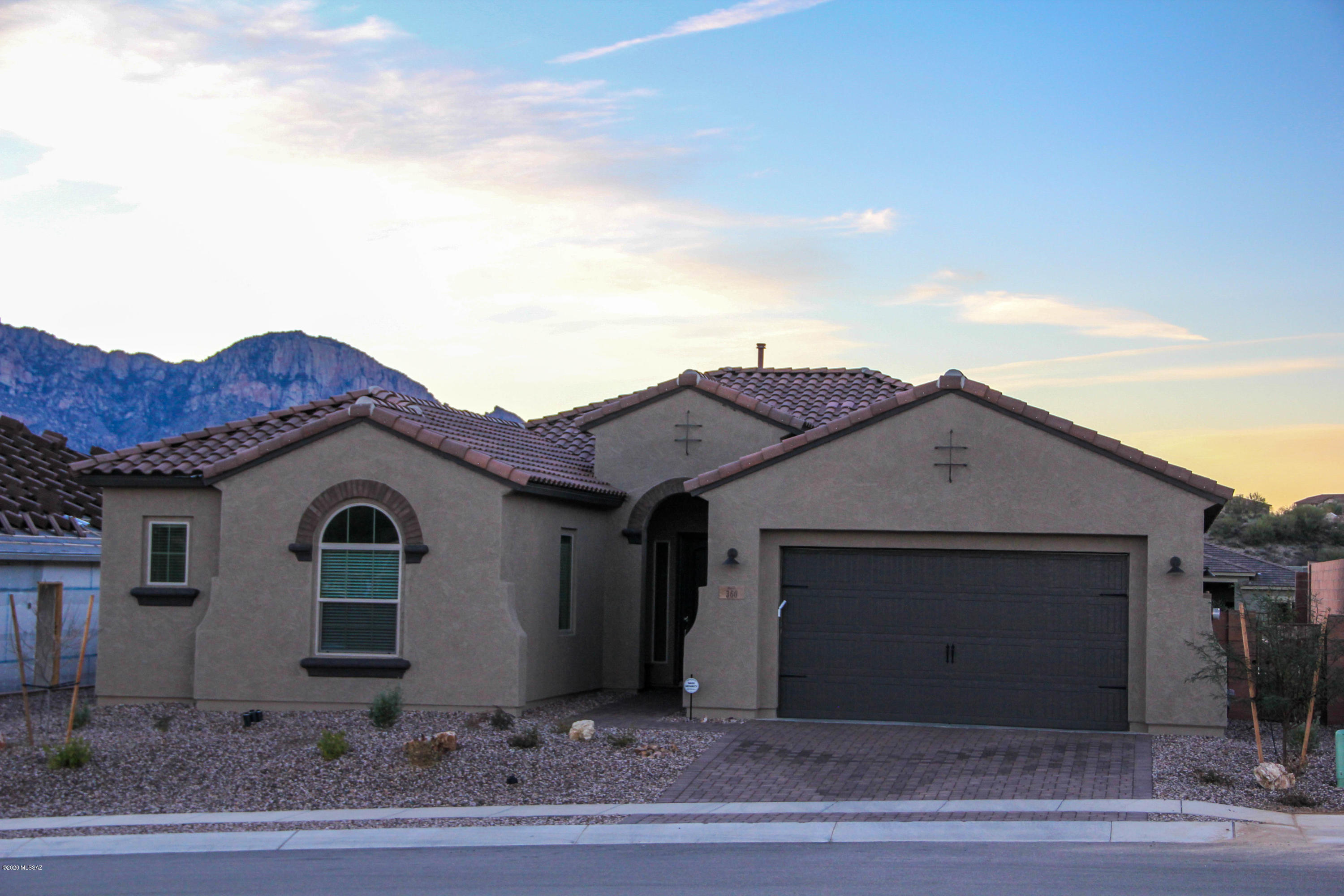 Stunning Pusch Ridge view of the Santa Catalina's in Rancho Vistosos's new gated community. Open Patina floor plan with Spanish elevation covers all the bases including a split bedroom floor plan, tile in main living area, soft water loop, and zoned AC with 3 thermostat system. Relax in your over sized backyard that the seller paid a premium (10' setbacks each side). An entertainers delight with a pebble tec pool, travertine decking, large covered patio, putting green with synthetic grass and block privacy wall. Natural gas stubbed in for that future BBQ. Many other upgrades makes any home owner proud to call this home. Come, see, and buy your dream home.