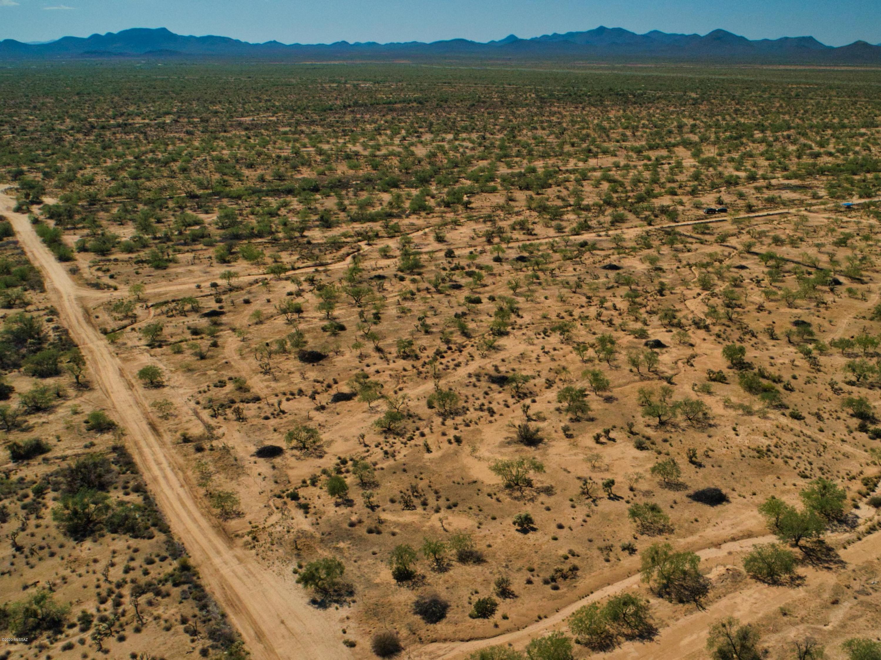 4.9 acres of generally flat fenced property with beautifully manicured trees. Property is on a shared well (8 split) and has electric available. Available to build your own home or have a manufactured home placed.
