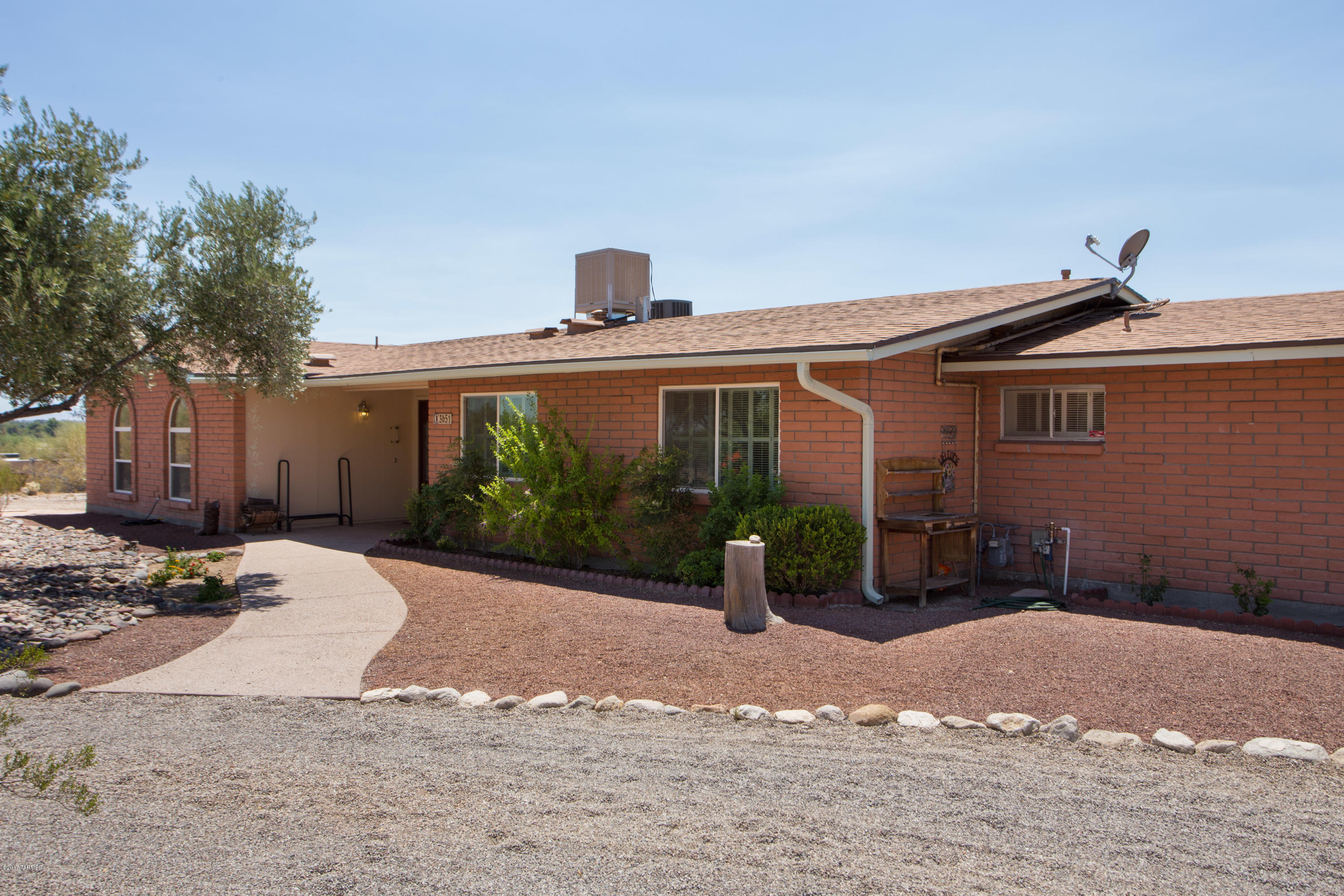 SELLER WILL COUNTER OR ACCEPT OFFERS BETWEEN $299,000 AND $315,000. Wonderful curb appeal which offers magnificent Catalina Mtn. and City views. Spacious bright open floor plan w/windows which capture Tucson's fabulous sunsets and changes in the Catalina Mtns. throughout the day! Open redesigned kitchen offers plenty of room for family & friends to share special times. Enjoy the new kitchen and new appliances as you prepare the evening meals. Spend time on the extended covered patio w/pool and the cool grassy lawn nearby. Separate yard for gardens or letting pets roam in their own space. Double gate and over-sized garage. Who said you can't have it all!?