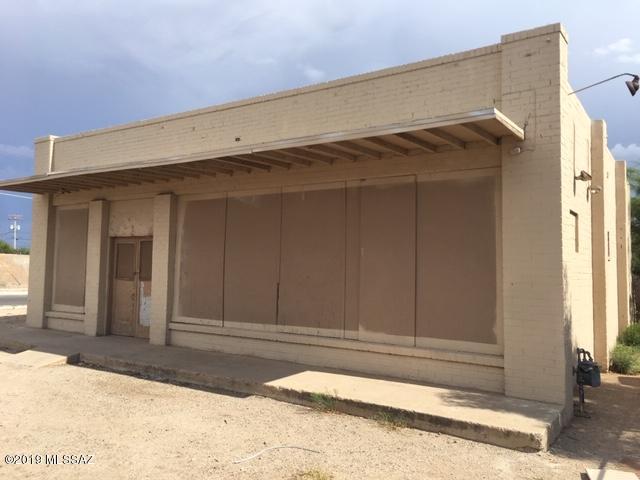 High VISIBILITY Lot! Zoned Industrial 1. Possible use for contractor, contractor yard, steel fabricator, plumber, welders,etc...Large open building used to be a mini market for the neighborhood. Older building has the historical type older red brick construction that is highly sought after here in the ''Old Pueblo''.