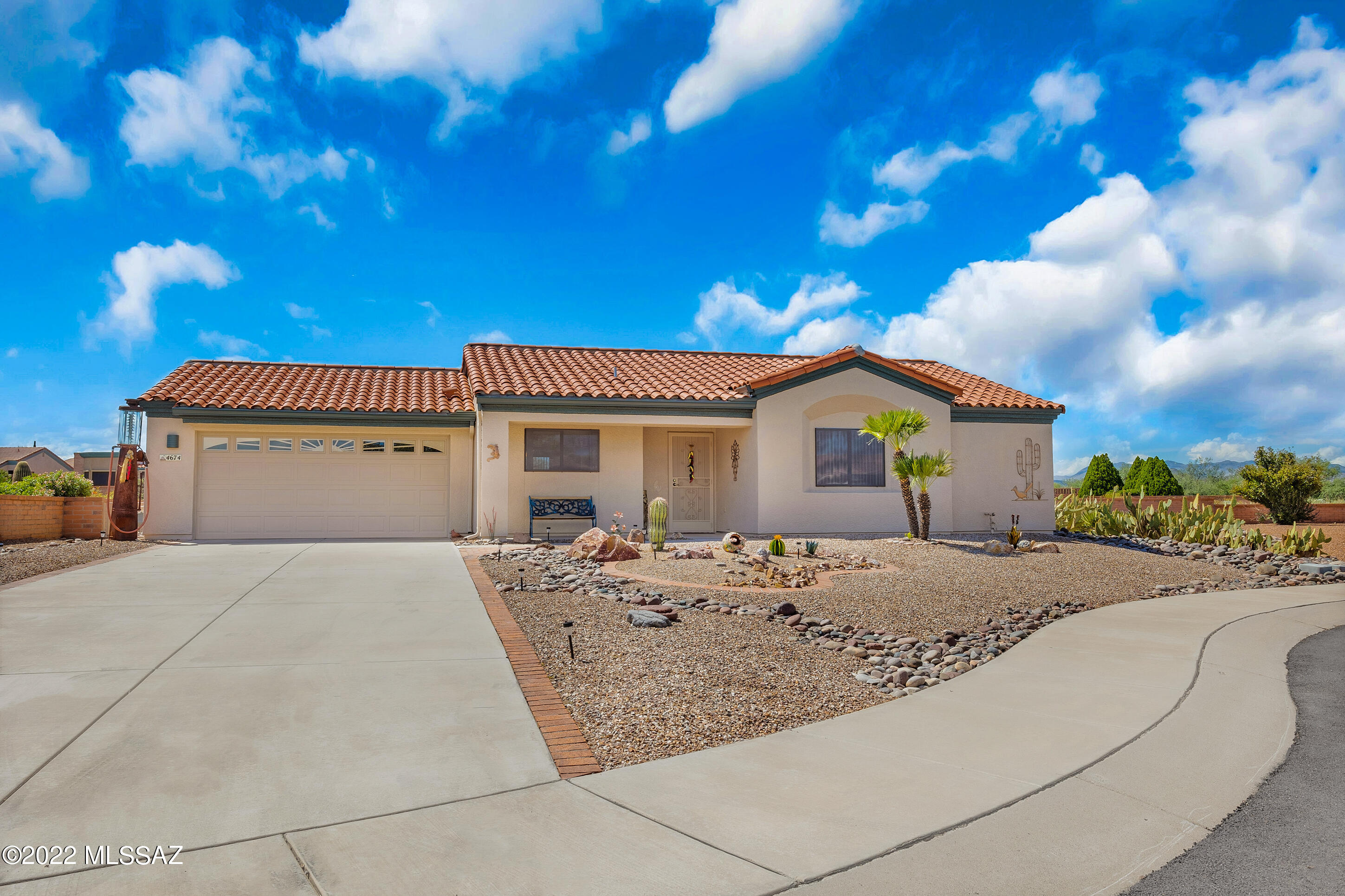 Absolutely charming with everything you need in the coveted San Ignacio Vistas! Located in cul-de-sac with mountain views in the front and beautiful sunsets to the back. Open bright feel welcomes you as you enter the vaulted ceiling to the great room. Primary bedroom boasts walk-in closet, while the second bedroom features Murphy bed for guests. Pantry in kitchen, and plenty of storage in garage. Back windows come equipped with privacy/security shutters. Bask in the gorgeous Arizona sunsets from your well manicured backyard after enjoying one of the many activities the community has to offer. New roof in 2022! This gem won't last long. Set up your private showing today!