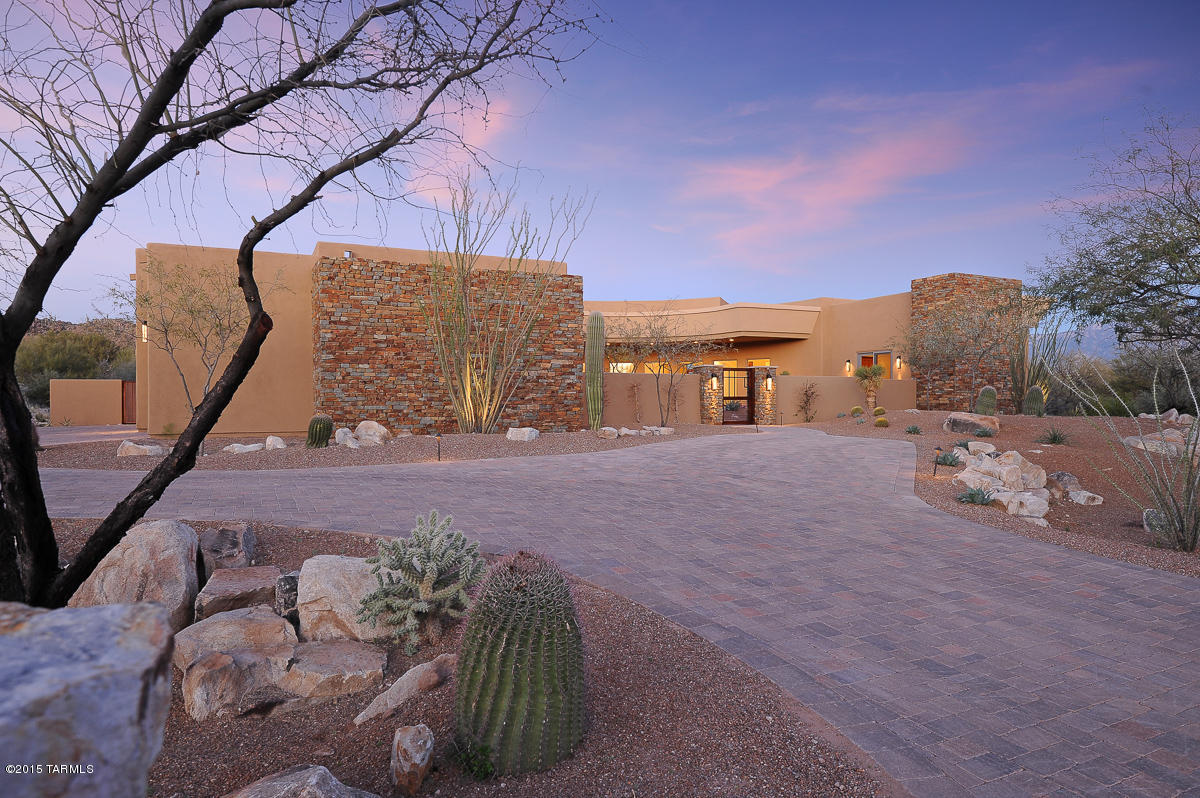 Stunning new Custom Contemporary with optional Casita boasts sleek lines, top-of-the-line amenities plus Wine Room. Situated in the exclusive gated community of Stone Canyon, this home's orientation provides Fairway frontage, Tortolita and Catalina views within a pristine, tranquil setting. Grand View windows provide ample natural light while polished stone finishes and mesquite wood flooring complement this home's interior. Open concept plan is ideal for entertaining w/bedrooms tucked away for privacy. Pre-wired with Smart Home Technology, relax in the Game Room equipped w/full Bar, multiple TV outlets & Pool Table setting. Ultimate Chef's Kitchen affords professional-grade appliances and bar seating. Resort-style backyard features Versi flagstone deck, pool/spa and grilling area.