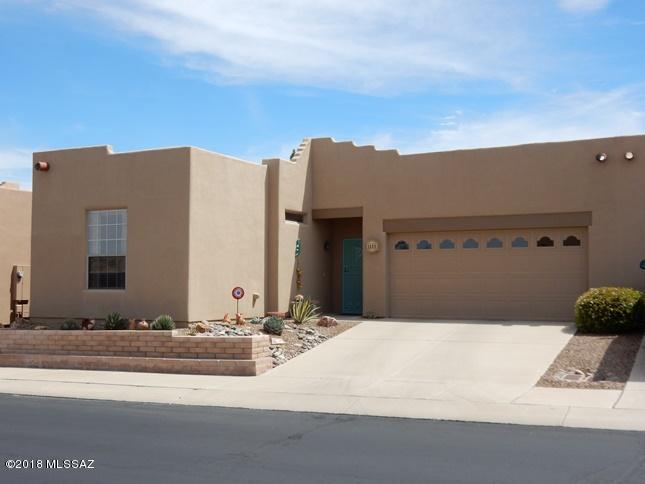 Beautiful, upgraded Santa Fe style townhome backing to common area with mountain views from home & patio. Close to The Springs GVR center, The Springs walking/jogging trail & Green Valley Hospital. Great floorplan with great room concept, split bedroom plan & two bedroom suites. Fully furnished per inventory with contemporary coordinated furnishings including two VIZIO smart TV's. Updated kitchen features newer granite counters, newer appliances, newer double stainless sink & Grohe faucet, newer hardware, breakfast bar, buffet & pantry closet. All appliances stay including newer radiant range, newer Bosch dishwasher & washer & dryer. Owner's suite features queen size bed, mountain view, walk-in closet & bath with shower. Guest suite features Queen size murphy bed with built-ins & drop down table, coordinating desk & bath with shower & tub. Other updates/upgrades include: ceramic tile floors throughout, upgraded lighting, decorator interior paint, Hunter Douglas window coverings & custom Southwest cornices, Kohler toilets & Bryant heat pump 2/15. Two car garage with built-in storage cabinets, workbench and utility sink. Extended bricked patio with added privacy wall, newer patio furniture & newer Kenmore gas grill. Immaculate & move-in ready. Must see!
