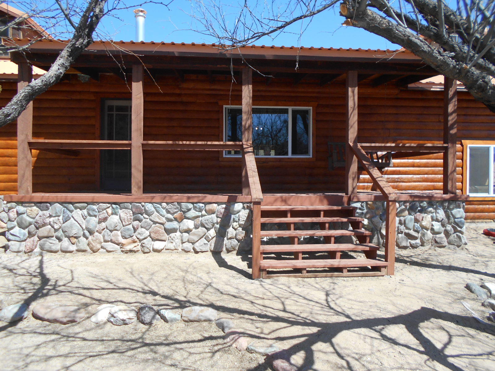 Beautiful Custom Log Home Horse Property on paved Cascabel Road with a spectacular view of the San Pedro River! This beauty is fully fenced with a large loafing shed and fenced in corral. It sits on 7.45 acres with a gate leading to thousands of acres of State Land for endless opportunities for riding, hiking, or off-roading! Less than half a mile to the San Pedro River for innumerable opportunities for exploring the unique beauty of a spectacular riparian area. A birders delight! Wildlife abounds in the peaceful privacy of this hard-to-find gem! It has a large workshop w/elec. and plumbed for a bathroom to finish into a guest cottage for your friends or opportunity for an Airbnb. RV space. Beautiful desert landscaping and a private Well with a shallow static level for long-term supply! - Lovingly maintained and move-in ready with all the comforts of home!  The adjacent 13 acre parcel on the North is also available for $54,000 to increase your horse property to nearly 21 acres!  Buy both and put in an arena and expand your operation.  The perfect place to be self-sufficient and escape the fast-pace of the city.  19 miles of paved road to Interstate 10 and Benson for convenient commuting to Tucson, and all the privacy you desire!  This is a rare find of this quality and affordability.  A great place to work from home with land-line internet access, or commute to Benson, Sierra Vista, or Tucson!  The possibilities are endless!  Don't miss this wonderful opportunity to get back to nature and live the life you've dreamed of!  Properties like this are hard to find, so don't hesitate, because it won't last long!