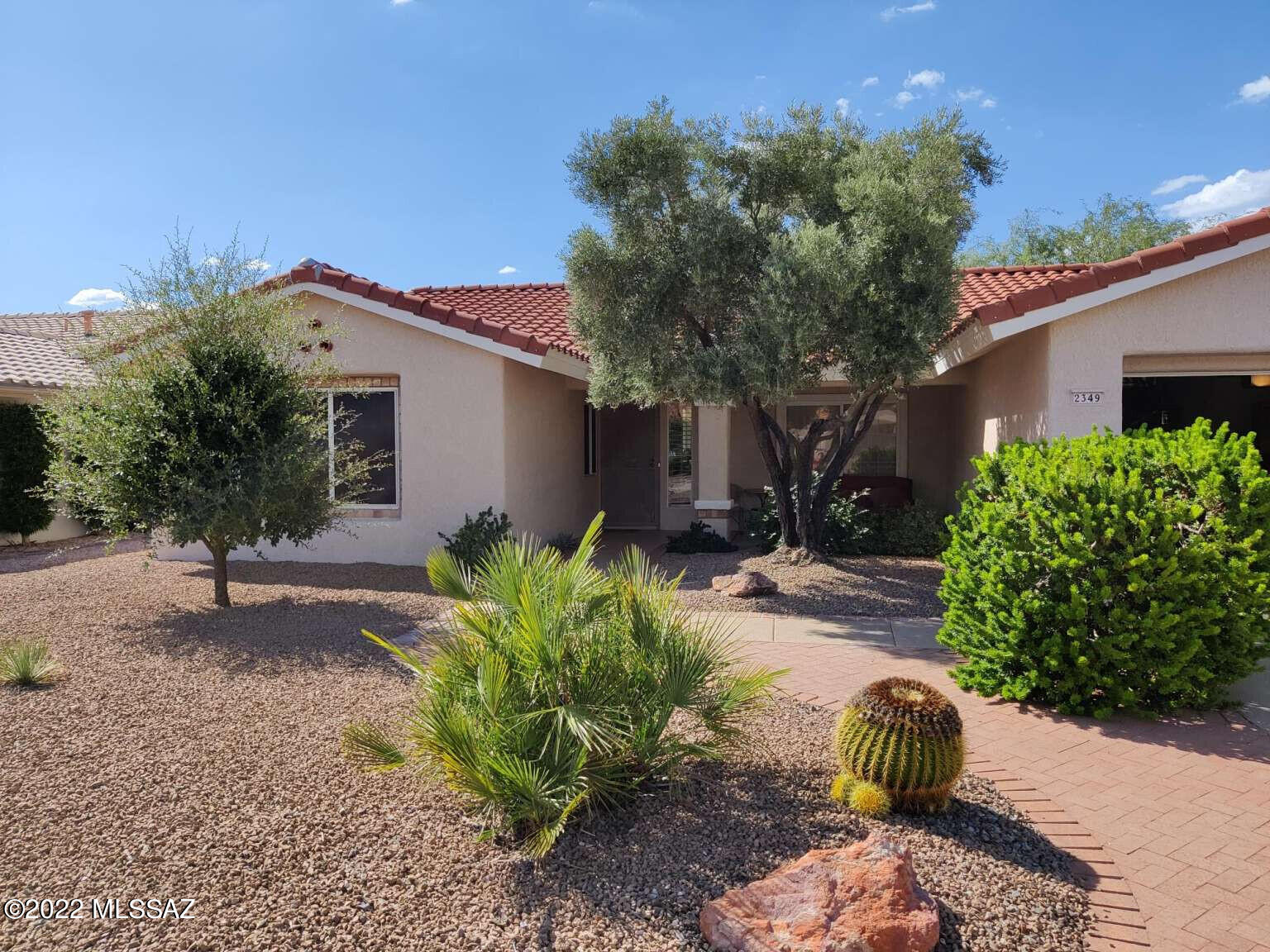 Located in Sun City, this is a move-in ready, 2 bedroom/2 bath home with an office/craft room and a large multi-purpose room (Arizona Room) with lots of light opening onto a flagstone patio adjacent to an orange tree! The kitchen has been remodeled and includes an in-kitchen eating area and newer appliances. Both bedrooms have new carpeting and a new modular closet system in the walk-in master closet. Newly painted inside and out. The owner's suite includes dual sinks and a closed-off walk-in shower. Both baths have been updated for a fresh, modern look. The garage is oversized. The roof is new, as is the water heater. There are a wide range of wonderful amenities, including a golf course, 2 pools, tennis, pickleball, bocce ball, artisan centers and dozens of clubs in this 55+ community.