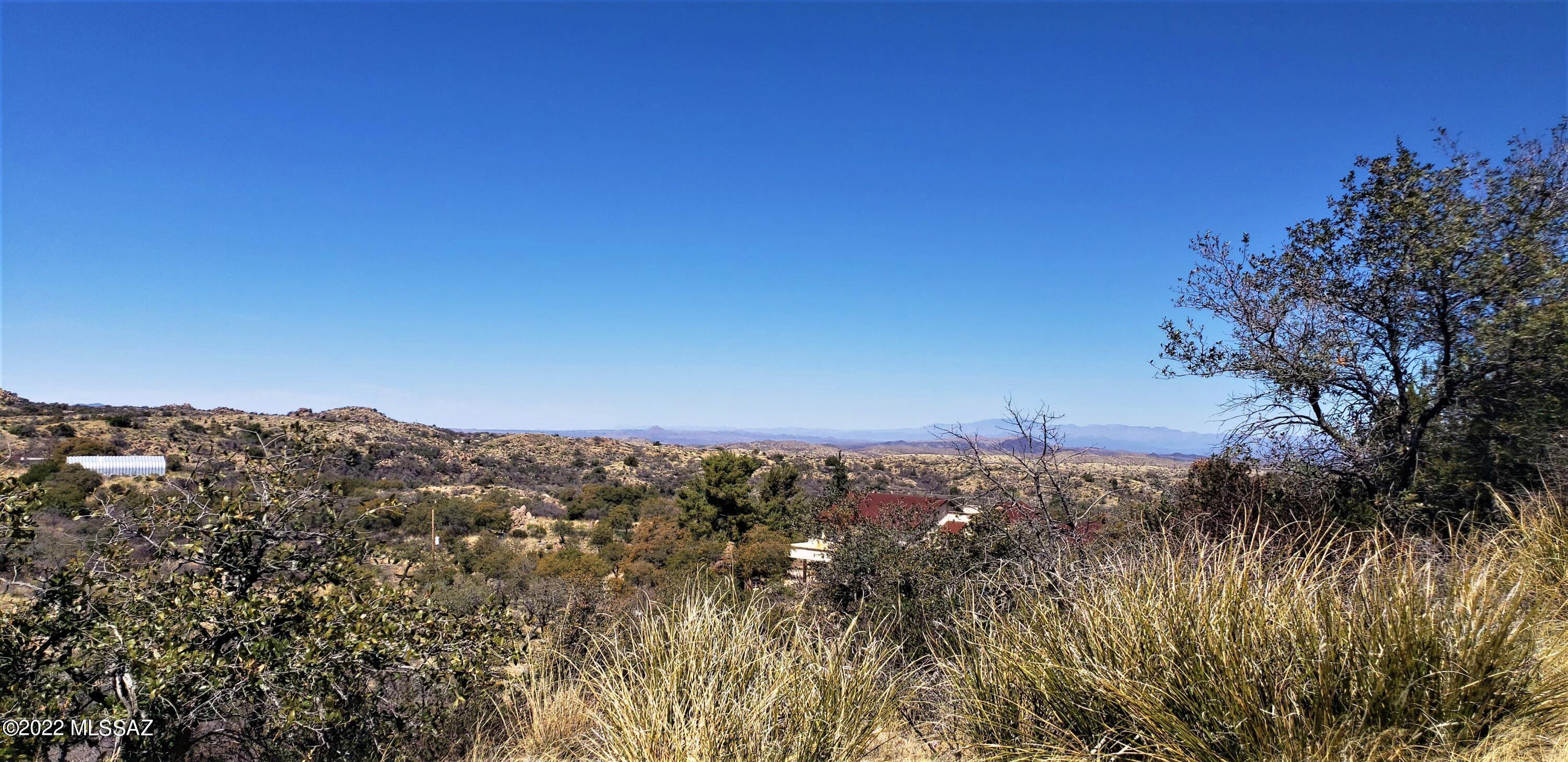This VIEW LOT has an entrance off CODY LOOP RD. It's a 25' wide and 813' long deeded strip leading to the bulk of this acreage. A rudimentary driveway/walking path has been graded in to allow access by foot or by a higher clearance vehicle due to the undulations in the topography. Bordering the National Forest on the east and south property lines creating a very secluded site.  This lot is on a hillside with a few spots that are less sloped. A small pad has been graded out at the end of the driveway to allow vehicles the ability to turn around. Septic and a well are needed. Wells are 200' in this area.