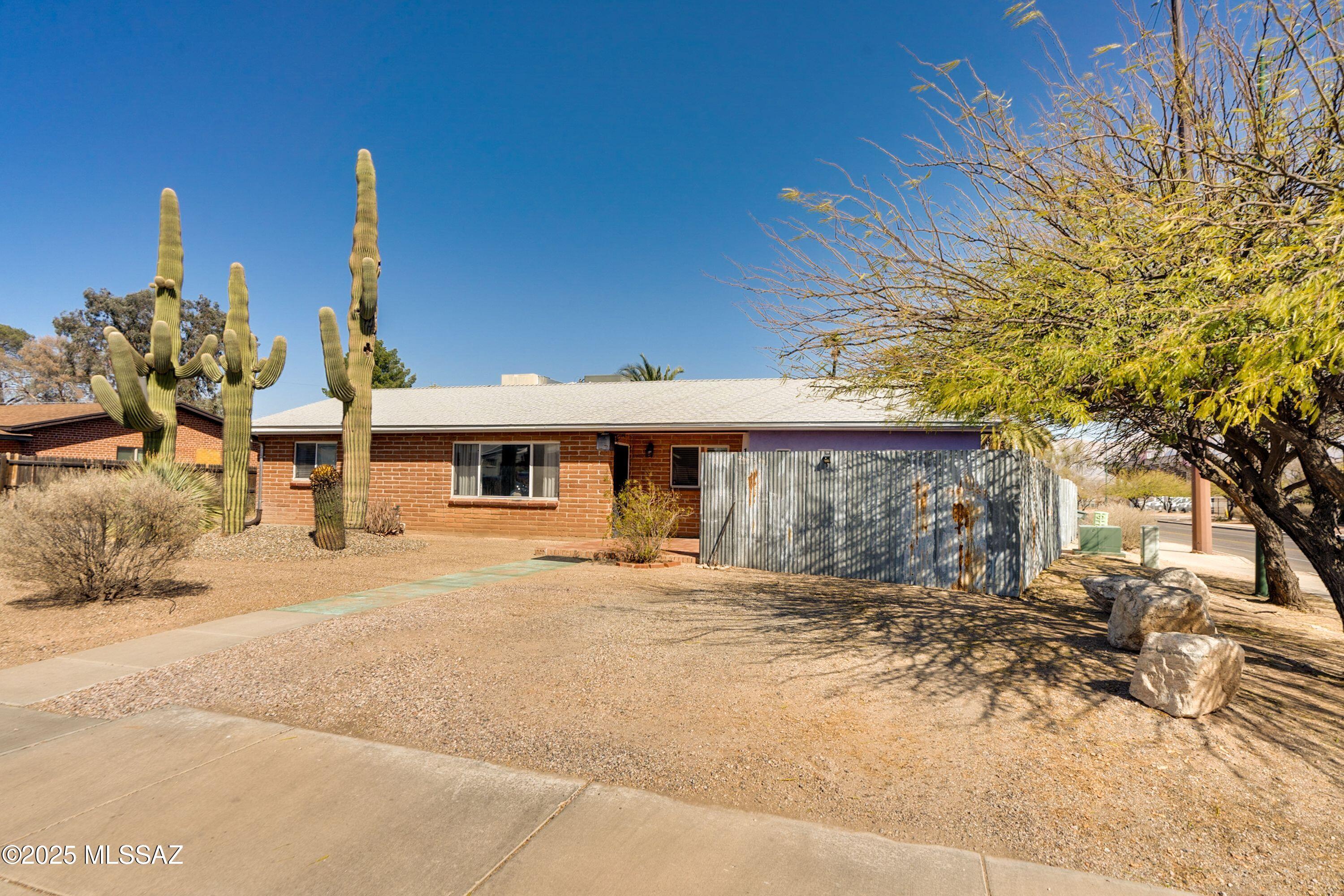 Beautifull well maintained mid-century adobe, 3 bedrooms 2 full bathrooms  home ready for new owners. GREAT location; minutes to Banners University Hospital, Downtown, Salpointe Catholic High School, biking path to UofA (1,5miles), river walk/bike path, grocery and other shopping, tons of restaurants. Spacious upgrated kitchen, with custom lights, granite counters, stainless steel appliances, lot of counter space and cabinets. Dual pane windows, large laundry room, walk in pantry, good size bedrooms and great room.
Plenty of space in the front yard for parking your truck or RV, carport, garage.... Lovely private backyard with mountain views to entertain under the covered patio, lot of room to play and a nice shed for extra storage. No HOA. Call for appt.