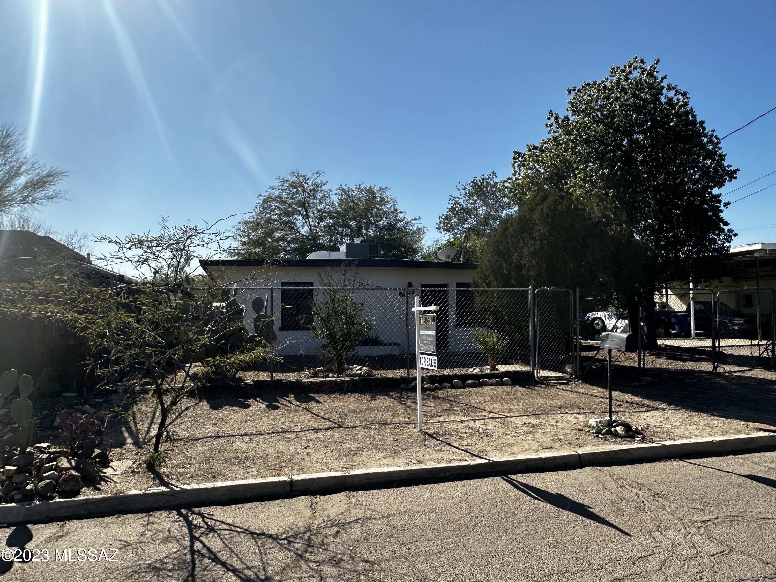 Newly remodeled two-bedroom one bath. Over 800 sqft of living space with carport, covered patio, large back yard including storage sheds, AC.  New paint inside and out, new roof re coat, and new wood flooring. 

Close to U of A, Pima, Tucson Mall, shopping centers, I-10, schools, parks, bus lines, and much more.