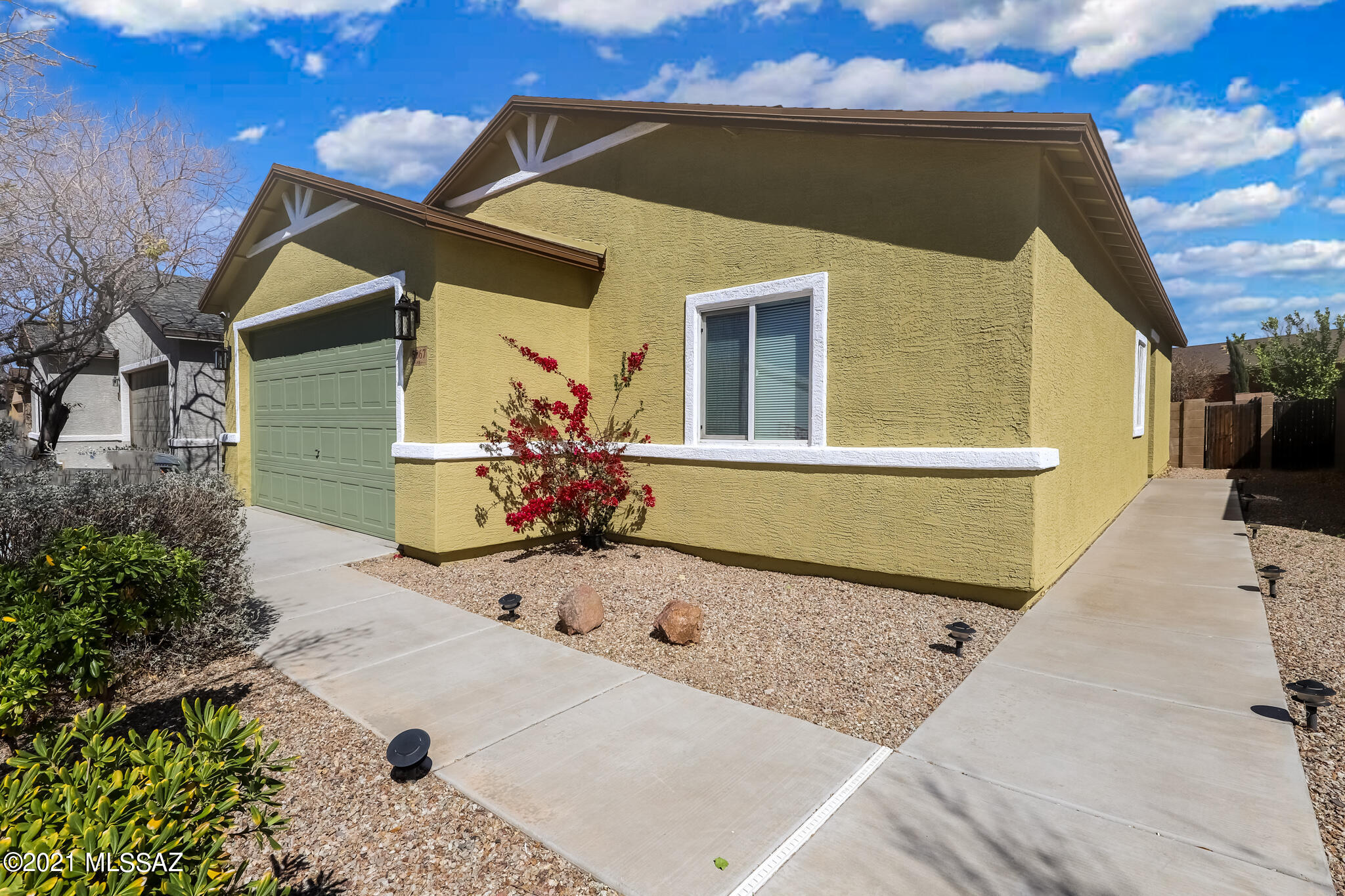 This fantastic 3 bedroom 2.bath home; has a great room, tile flooring in all the common areas and carpet in the bedrooms. Beautiful kitchen features; espresso cabinets, tile countertops, stainless steel appliances, dining area and pantry. Spacious bright bedrooms freshly painted. new exterior paint, new blinds, owner suite with a walk in shower. Serene backyard setting , Perfect home for entertaining and ready for your personal touches.