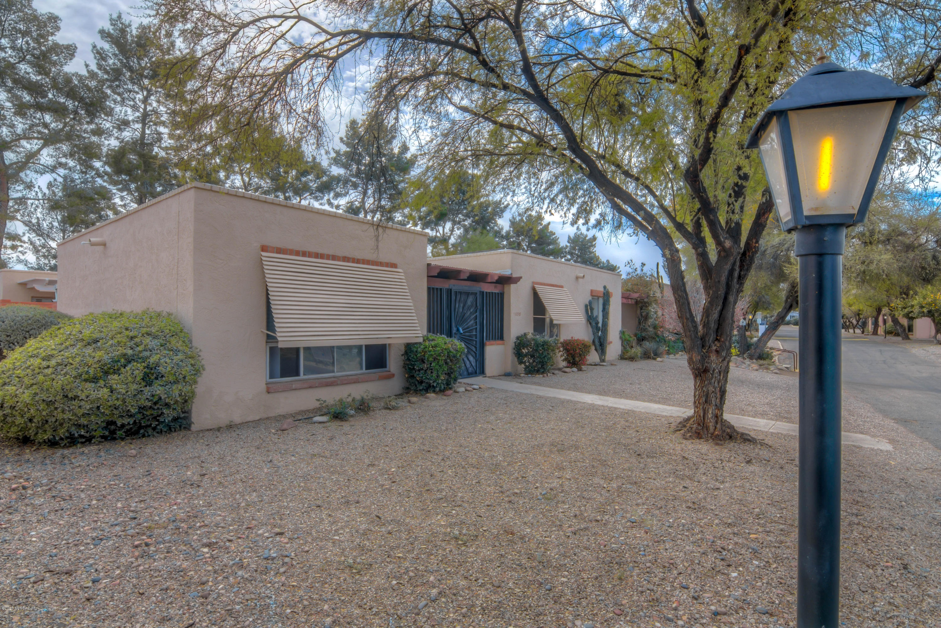 Immaculate & updated 2BR/2BA town-home! Remodeled with newer laminate flooring & cabinets, SS appliances, & granite counters. 2 spacious bedrooms w/ walk-in closet in master. Natural light, tile, enclosed front entry, & all appliances convey. Master bedroom has sliding glass door into private yard with extra storage. Roof was re-coated in 2017. HOA includes community pool & landscaping of front yard!  Conveniently located close to dining, fitness centers, parks, shopping, medical & bus lines.