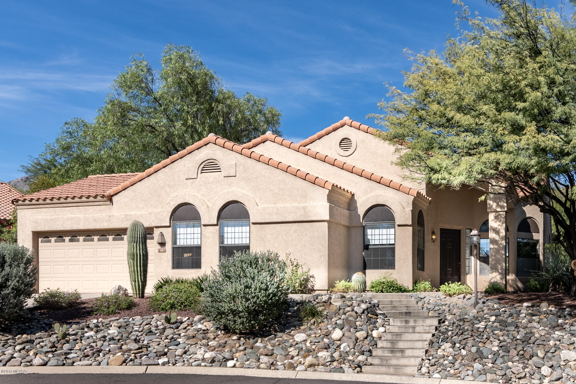 One of a Kind Private & Quiet Golf Villa in Gated Ventana Canyon Country Club. 3 bedroom plus den, 2 bath & bonus golf cart garage. Completely remodeled w/new ceramic floors, granite tops, stainless appliances & vaulted ceilings. Larger 2450 SF plan on quiet cul-de-sac over-sized lot. Great north facing patio w/ room for dining and mountain view over Mesquite trees in common area.  Walking distance to Club / Lodge for Golf, Tennis, Pickle ball, Swimming, Dining, Lodging for guests and more. Heated community pool and spa, HOA handles landscaping of front yard and common areas. Shopping and dining nearby including Sabino Canyon Recreation area for hiking and biking. Come live the Resort Lifestyle in this Lock & Go Golf Villa.