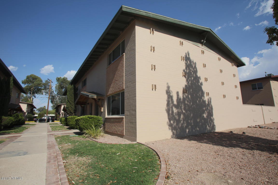 This sharp remodeled condo that has ceramic tile, newer carpet and paint. Cooks kitchen features granite countertops, center island/breakfast bar, smooth top electric stove and built in microwave, dishwasher, pantry and loads of cabinet space. Large living room, dining area off kitchen and powder room make up the first level. Three bedrooms and a double entry bath upstairs. The backyard is sized just right. Low care living with community pool across the street and ample street parking in addition to carport. Association fee is paid by the owner! VERY CUTE and affordable in convenient central location within walking distance of shopping, dining, the University and so much more. Cats ok