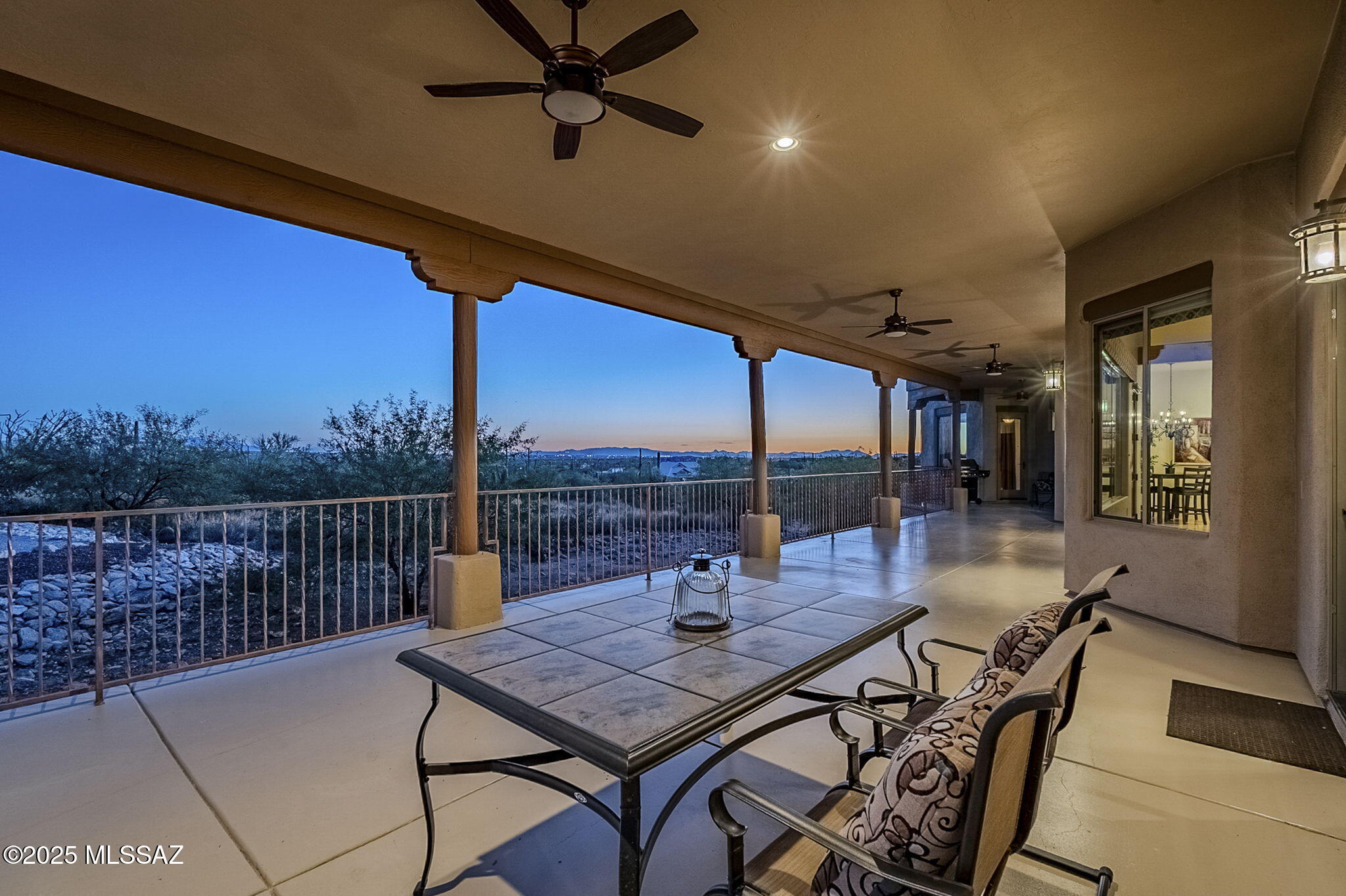 Stunning southwestern style home nestled on 3.31 private acres in gated community with breathtaking mountain views & starry nights. This 5BD/3BA features 3,318 sqft of living space with Viga beam ceilings, travertine floors & alder doors/cabinets throughout. The chef's kitchen boasts SS appliances, island with prep sink, granite counters & abundant cabinetry. Enjoy the amazing desert sunsets & city lights from the expansive covered patio, relax by the cozy kiva fireplace in the great room or retreat to the luxurious primary suite w/jetted tub, walk-in closet & sitting area. Over height, extended length 3-car garage w/storage cabinets plus a heated/cooled workshop/storage room. Near Mt Lemmon, Agua Caliente Park, hiking & biking trails, and in Tanque Verde School District. Voluntary HOA.