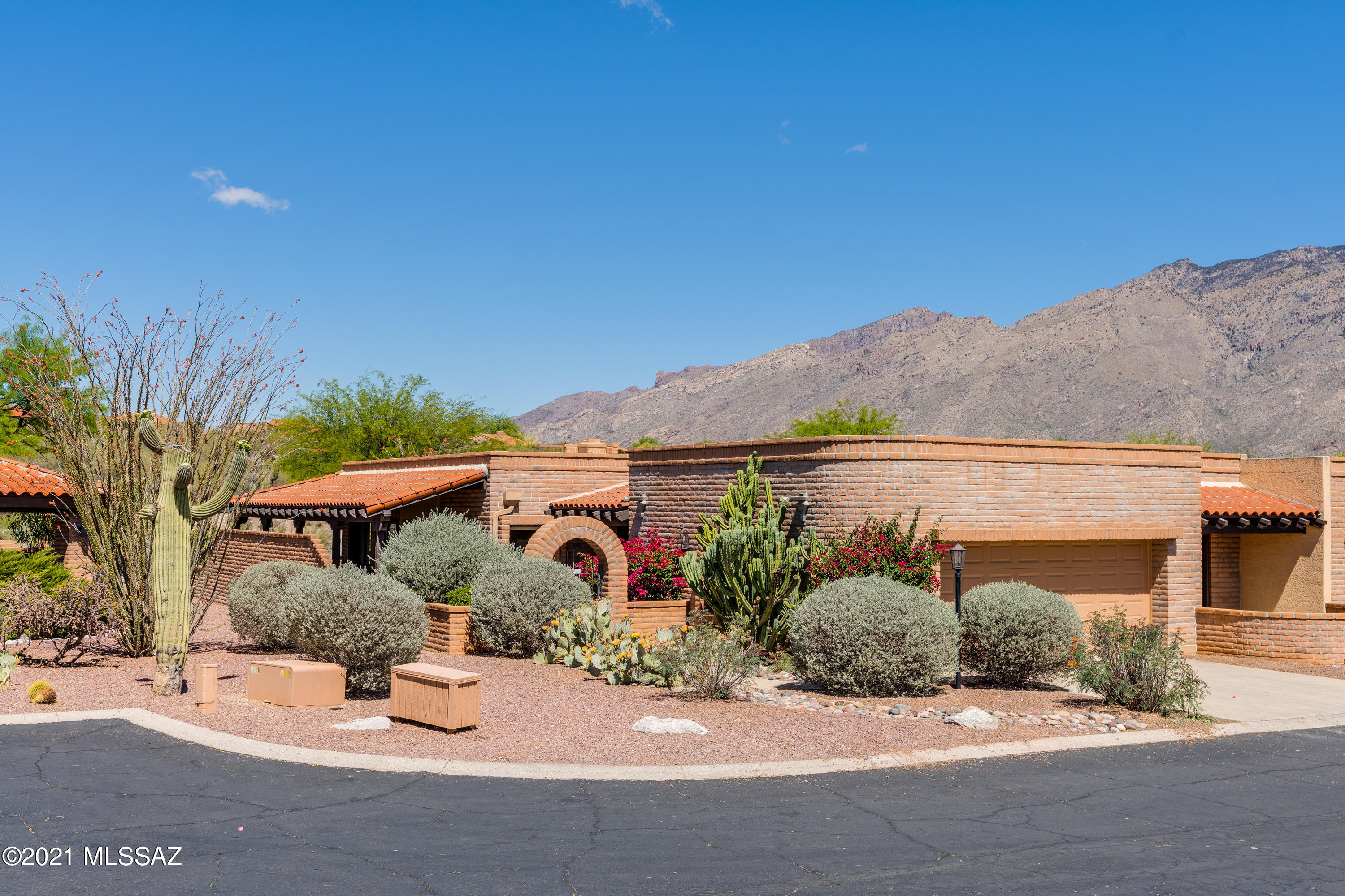 Delightful Fairfield townhome. Mountain Views from inside & out. Wrap around covered patio to enjoy those Tucson views! NEW roof 4/21. HW 2/17.  Patio cover freshly painted. Home original but in good condition so you can move right in or make it your own with an update. Community pool, tennis & spa. Welcome home!