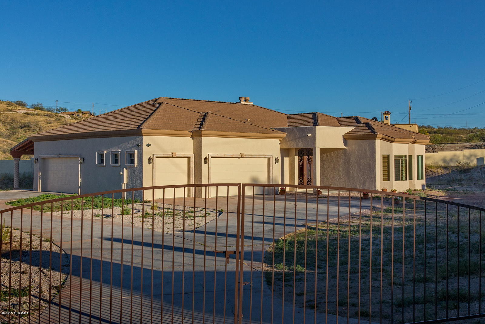 Wow! Under $100 per SF for this custom home with more upgrades than you might expect in much more expensive homes! Over 3,000 SF that includes 4 bedrooms, 2.5 baths, a family room, a media or playroom, a formal dining area and a room with a built-in bar. Entire home has been repainted in and out! There is a 5 bay garage to store your vehicles or make part of it a workshop or studio. Property is gated for privacy.