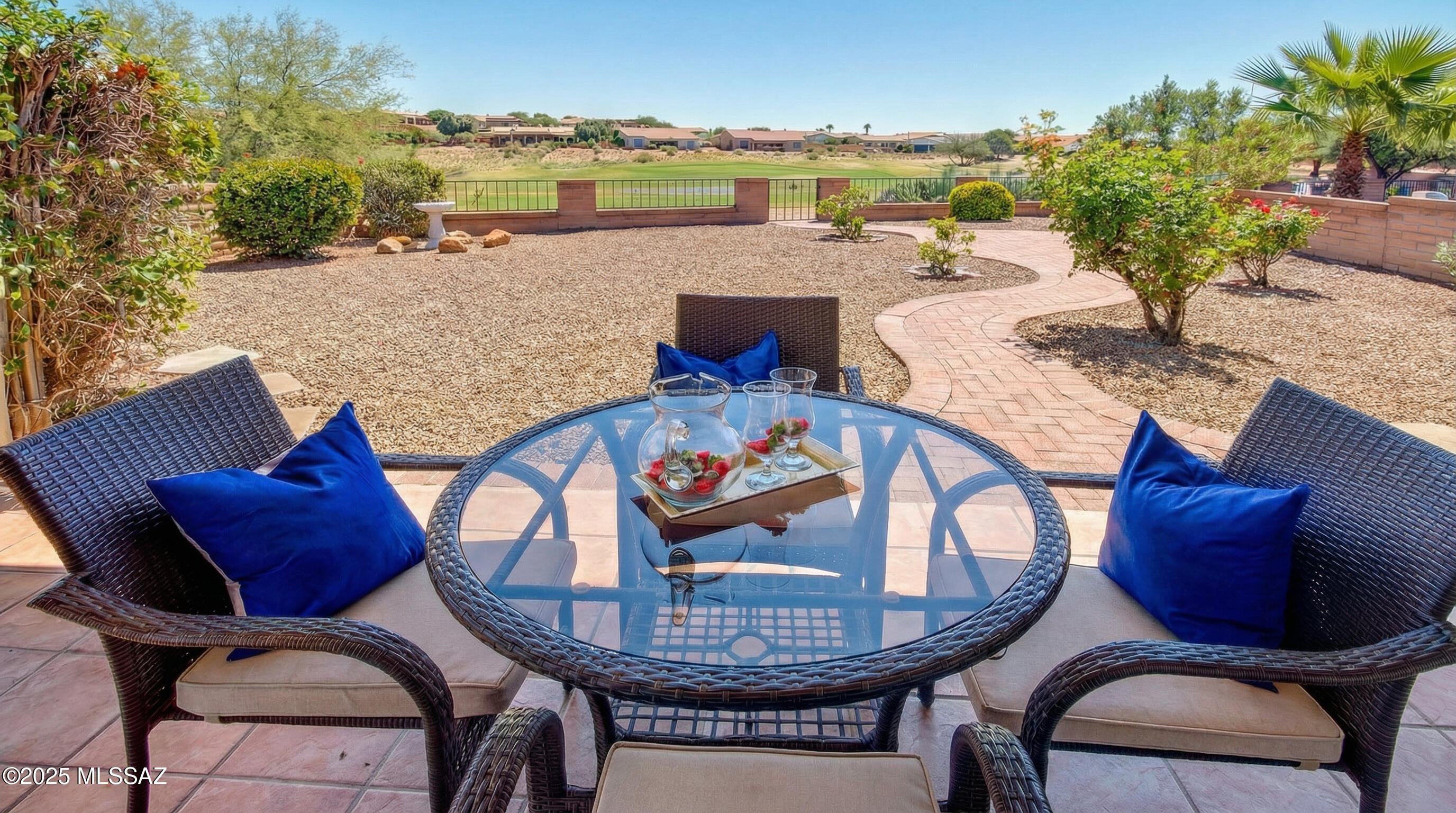 Stunning golf and water views on signature 13th hole from the back patio. 1,720 sq ft townhome features 2 bedrooms plus den,2½ bath,and 2-car garage with built-in storage cabinets and space for golf cart and/or shop.The fully updated kitchen includes SS appliances,pull-out shelving,new granite countertops and backsplash,and a breakfast bar from which to enjoy the view.An expansive primary suite offers an oversized Jacuzzi tub,step-in shower,generous walk-in closet,and light-filled double vanity.The 2nd full bath includes sauna and shower seating.Designer-commissioned tile flooring runs throughout the home,with exception of new carpet in primary bedroom. Water softener&freshly painted exterior and interior. It's a standout home within one of Green Valleys most popular golf neighborhoods!