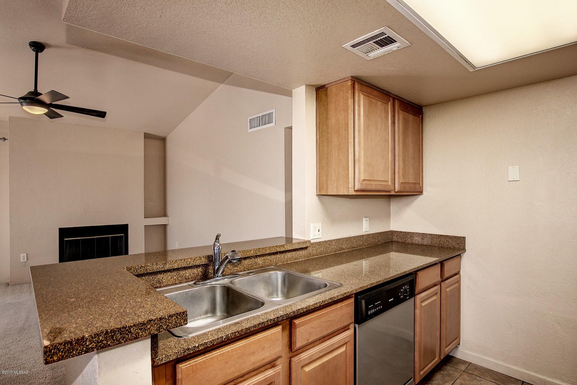 Move in ready condo in the Moonrise at Starr Pass community! Wonderful open floor plan with neutral paint tones and plush carpeting throughout. Upgraded kitchen features stainless steel appliances, granite counters, raised breakfast bar, and ample cabinet space. Two spacious bedrooms! Master has an adjoining bath and walk in closet. Spectacular mountain and city views from the extended balcony! Community amenities are nearby including walking hiking biking and golf! This home is ready and waiting for you! See it today and start living!