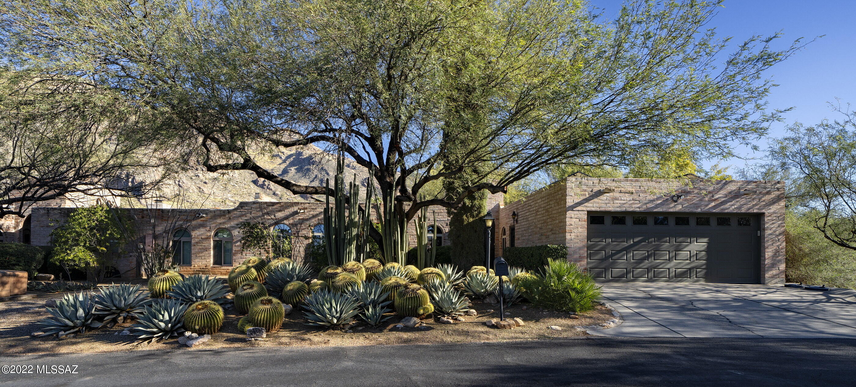 Set in the exclusive guard gated community of Skyline Country Club, situated on a premium mountain and golf course view lot, exudes luxury, lifestyle and exclusivity, anchored by 24­-hour security.Retaining the essence of the original architecture, whilst creating a renewed vision of amenities and services an owner of this caliber would expect. This unique end unit opportunity provides a conception of light, functionality and design, highlighting the coveted and sweeping Catalina Mountain views and the greens of the 5th fairway. The fit out and quality of finish throughout is incomparable and proportioned with elegant architectural features, utilizing a delicate balance of materials, textures and finishes, bringing a sense of casual elegance to the space... As one travels between the individual spaces, dramatic landscapes unfold, allowing for an abundance of natural light from every room. Transparent facades, fuse the indoor and outdoor living environments, used to derive a sense of spatial richness, that physically connects the interior to a generously shaded Northern veranda. A rooftop deck exposes multiple view corridors extending the various surrounding mountain ranges, as well as city lights to the Southwest and the dramatic desert skyline. This experience creates a gradual transition from the materially warm interior spaces, to the expansive outdoor courtyards that are perfect for entertainment, or simply watching the evening sunsets melt across the Catalina mountains.