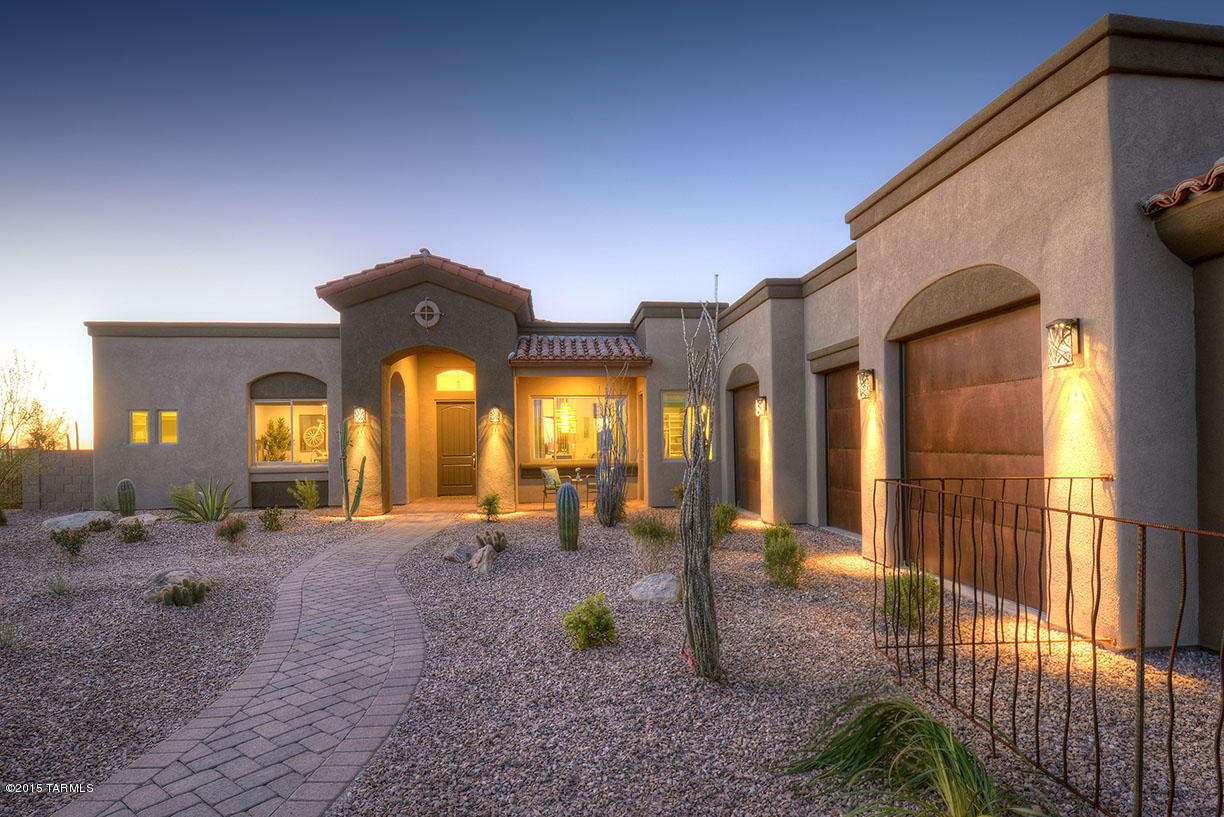 NEW PRICE! MODELS OPEN EVERYDAY 10-5:30. Large lot with Views! Lease back opportunity available on this model home. Dove Mountain at it's finest. Come see the newest NW gated community, Miramonte at Boulder Pass. Extended front porch invites you into this well appointed 2758 Sq Ft home that features 3 bedroom all with private baths, den, powder room & 3 car garage very open Great room floor plan! Large chef lovers kitchen with 2 islands, wine fridge, custom cabinets & Silestone countertops, prep sink and walk-in pantry. Extended master suite flows to spacious upgraded master bath. Step out onto the spacious covered patio and enjoy the beautiful Tucson sunsets in your professionally landscaped backyard with waterfall, extended paver patio, outdoor fireplace and synthetic turf.