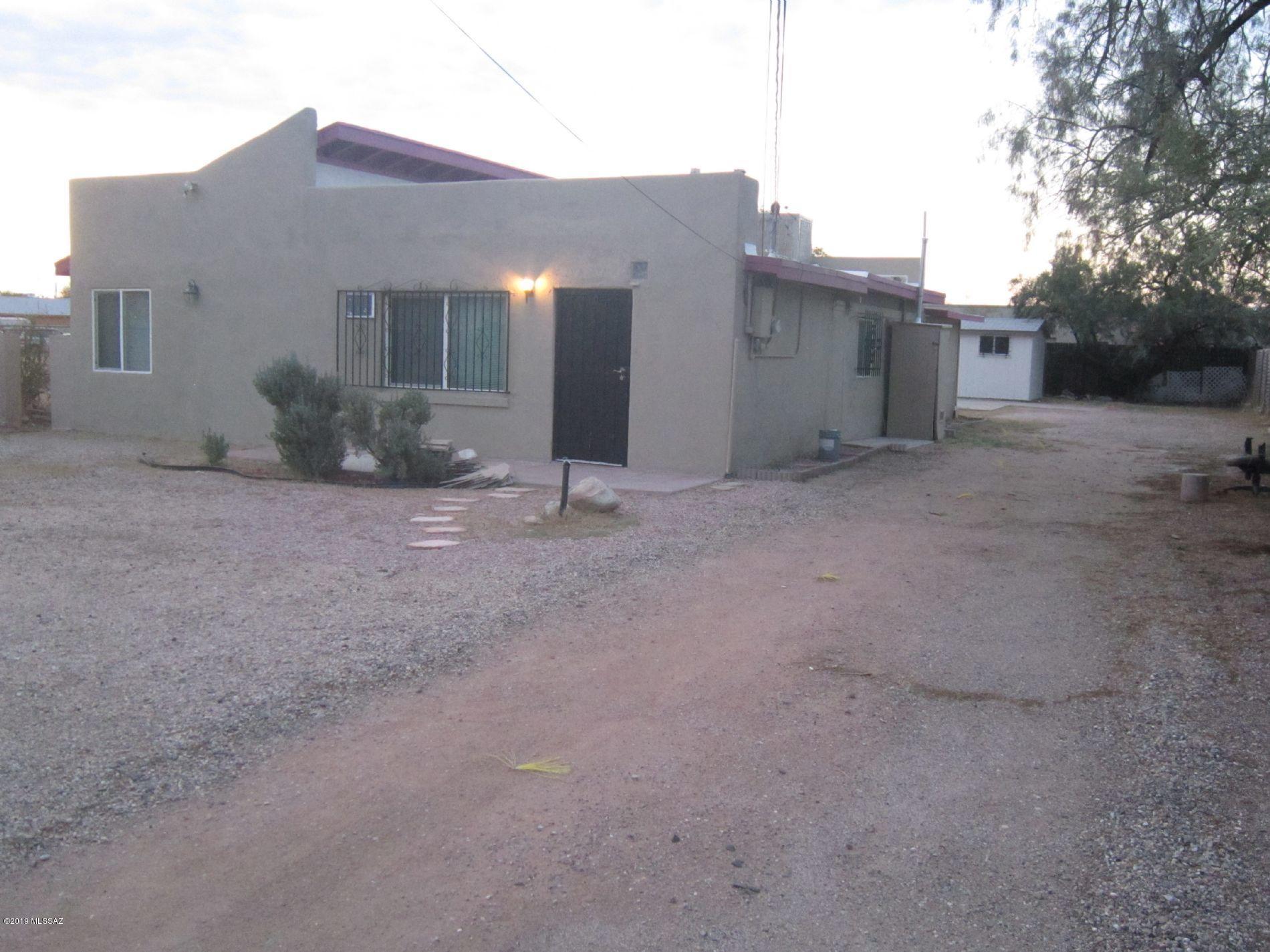 Just remodeled 3 bedrooms plus den/office, 2 full baths home. Gourmet kitchen with brand new cabinets, new granite counter tops, new designer faucet, under-mount sink, and new built-in microwave. New upgraded carpet, brand new A-grade18'' ceramic tiles, ceiling fans, and fresh two tone custom interior and exterior paints. Upgraded dual pane windows, new bath vanity, brand new water heater & gas line, and new roof shingles. Landscaped yard with covered patio, artificial grass & mature trees. Dual cooling with central evaporative and walled AC units. Huge chain linked R3 zoned lot with large insulated storage unit. Repairs completed, clear termite report, below appraised value, quick closing/move-in.