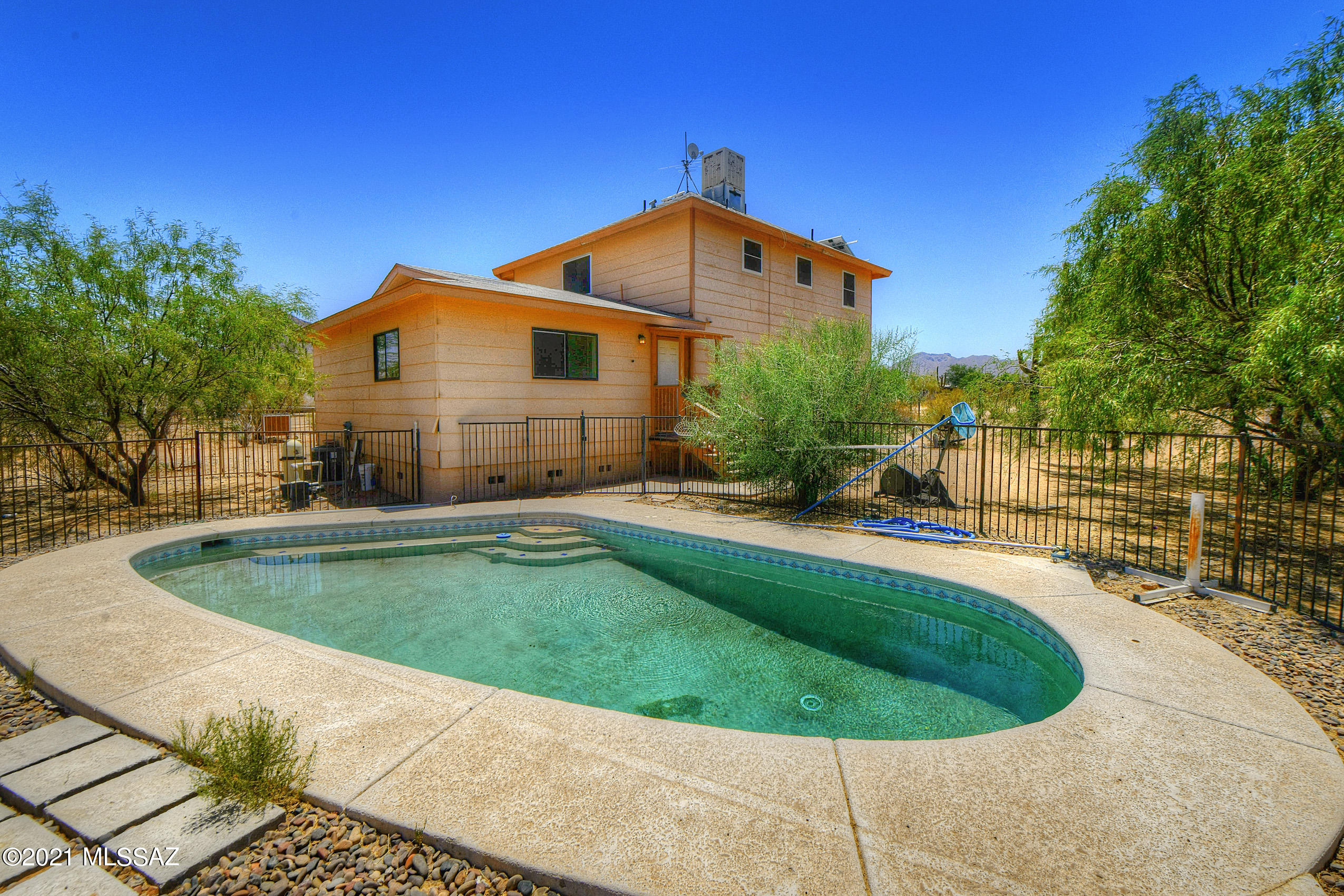 Awesome home has it all!  Space, land, pool, and no HOA!  4 bedrooms with 3 full bathrooms with Den/Office.  2 Master bedrooms, one on each level.  3+ acres with beautiful Mountain Views!  2 storage sheds & 2nd hook up for a house all utilities and site septic, water/electric.