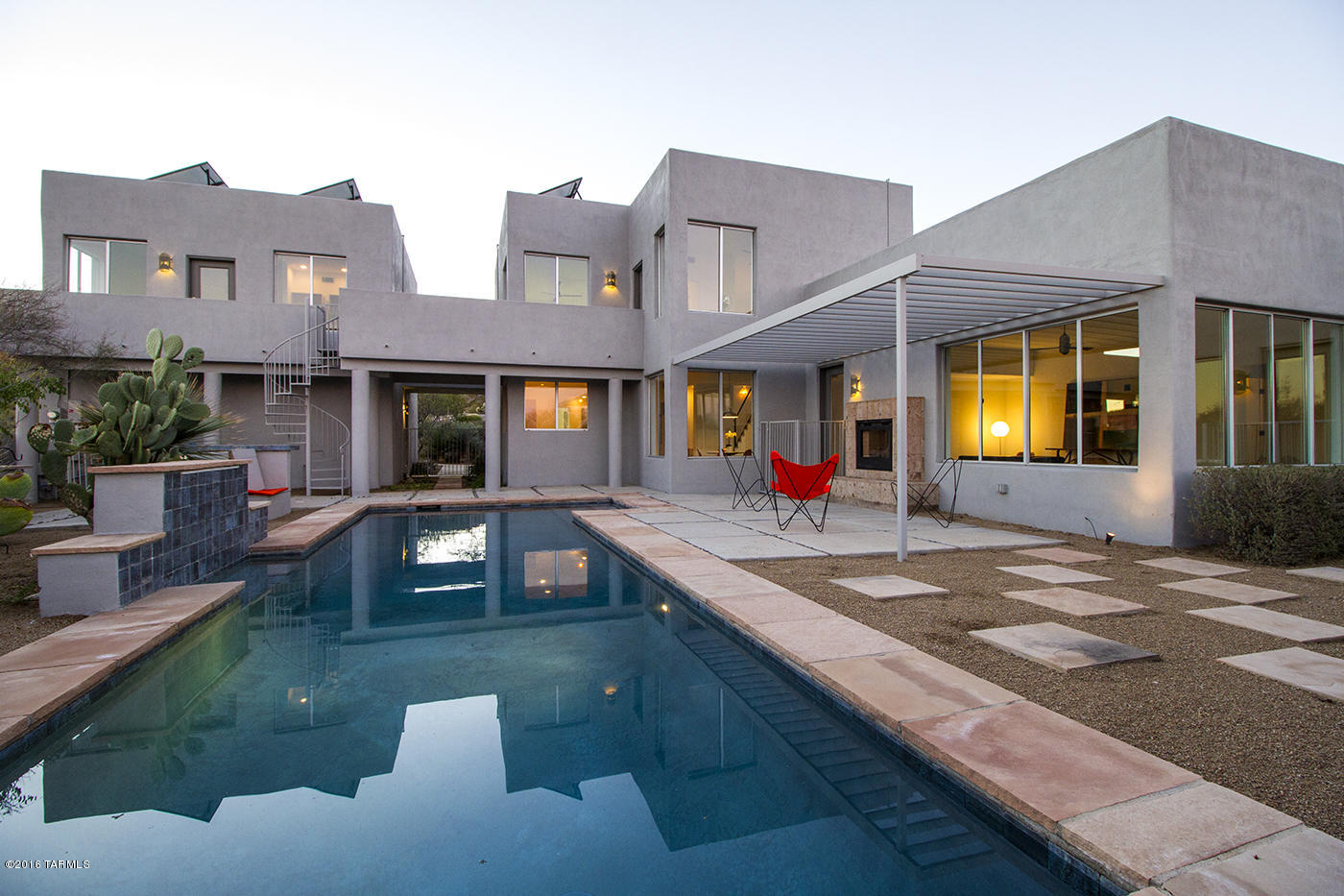 Modern minimalist Desert Dwelling. PLACED-- perfectly to capture views! ARCHITECTURE-contemporary, alluring--creating pulls & pushes to look around a corner, SPACE-natural, light filled, CEILINGS---high/ out of sight--show off your art! DETAILS--Scored Concrete Floors, Indoor/Outdoor Fireplace-bringing outside in and inside out. & Modern Minimalist Styling-outside as well, Salt Water Pool, Rooftop PV-Solar providing electricity for inside and out. Guest quarters-separate... autonomy to come and go. Gated-Tohono Ridge - private, secluded - minutes from downtown, the Mercado and Modern Street car. Starr Pass Golf Course, Marriott Destination Resort, with fabulous Spa.