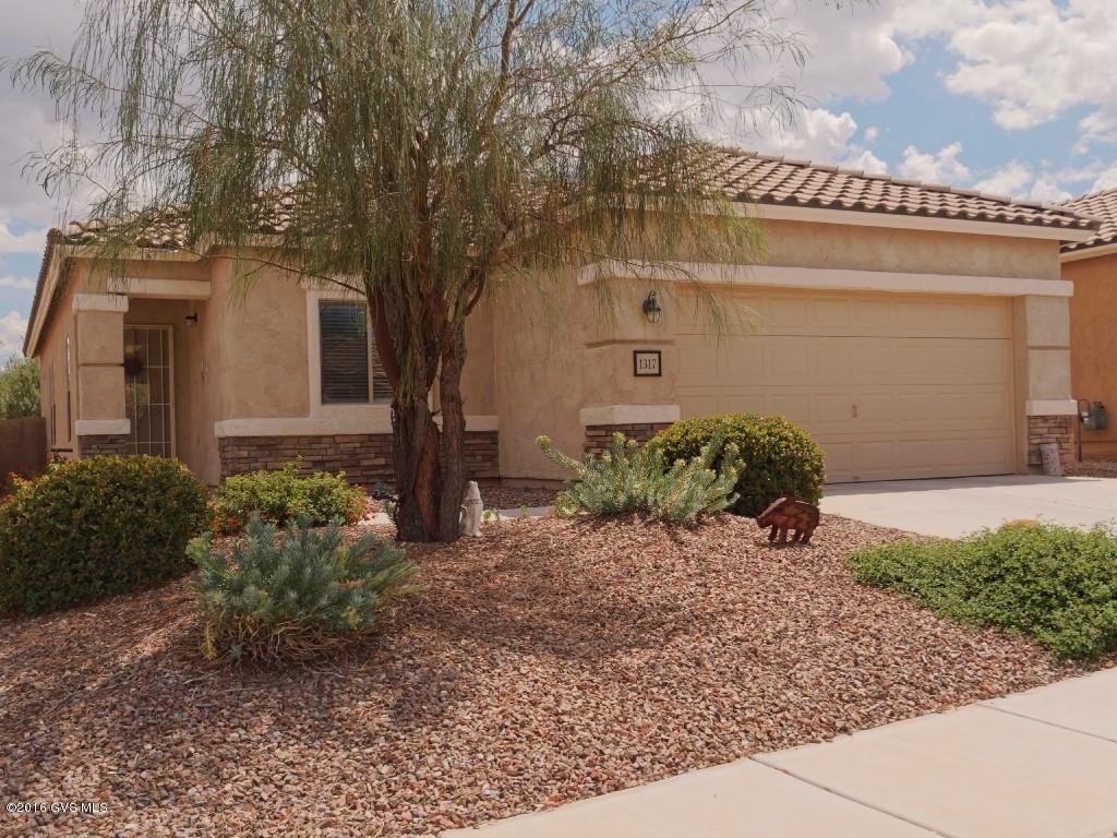 Welcome to this lovely, 3 bedroom, 2 bath, Del Webb home located in Rancho Resort's Las Brisa Community. The kitchen offers GE stainless steel appliances (2014) with an island overlooking the spacious great room and dining area. You can walk out your sliding glass doors to enjoy lovely natural habitat views, plantings on drip system. Split bedroom plan, walk-in closets, lots of storage, two car garage. Newer heating and cooling (2014). Decorated like a model home. Move in condition. This is a gated community and a 55+ community located in Sahuarita Arizona. Loaded with lots of activities, 52 clubs, including a Rec center, pool, spa, tennis, and much more for the active lifestyle.
