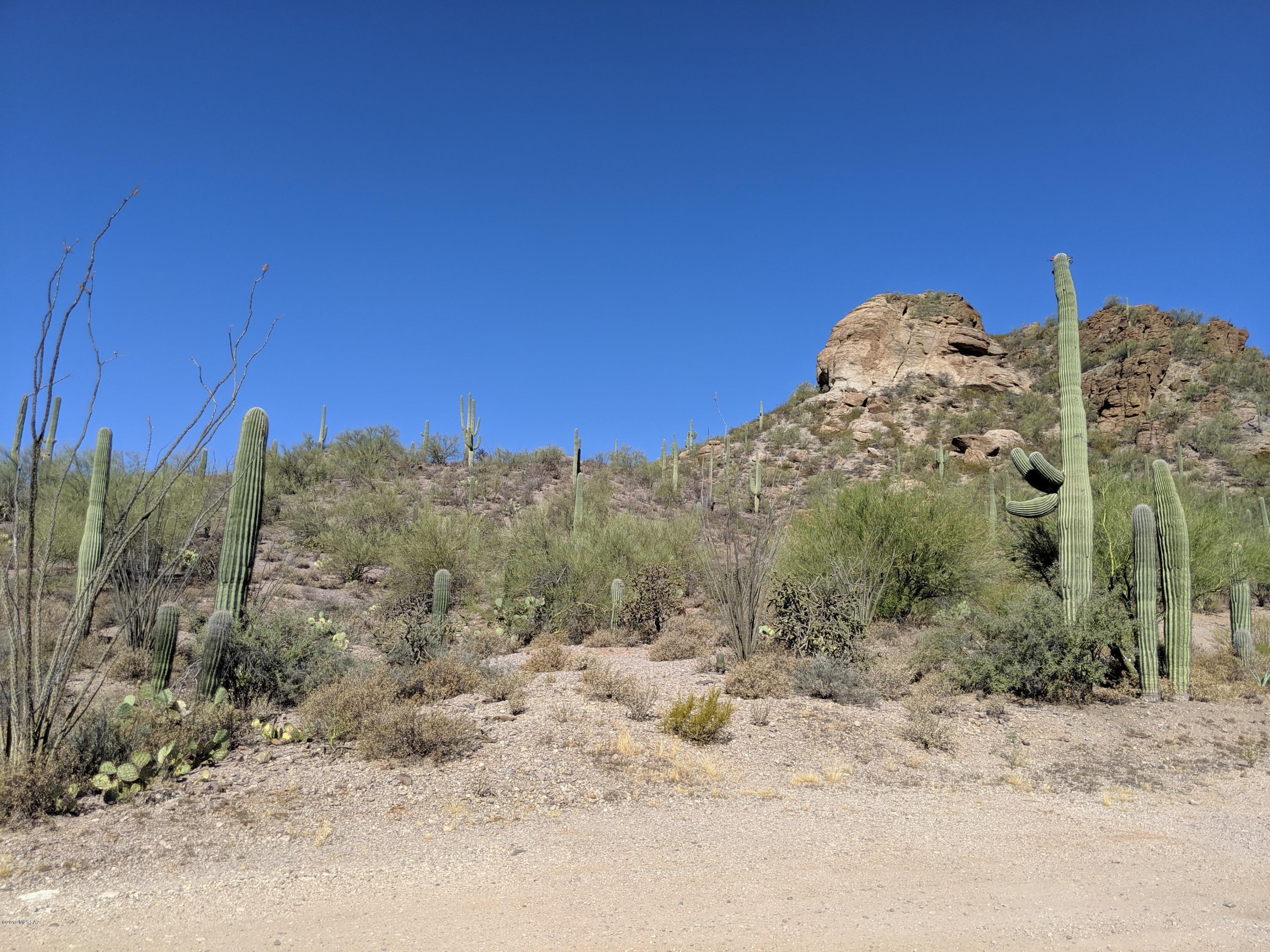 Million dollar views! This incredible lot has amazing views all the way around. Breathtaking city views in the front, panoramic mountain views in the back and saguaro-studded, desert landscape. Must-see to appreciate! Engineering survey has already been done and shows exactly where you can put your dream home. Beautiful 3.85 acres, secluded location, and proximity to shopping, dining, and highway makes this a rare find. Come see it and imagine your new custom home here. The lot has a shared water well agreement (recorded with Pima county) and electric at the lot line. Seller performed some test drills and believes the lot will accommodate a traditional septic tank.  Owner financing is possible.