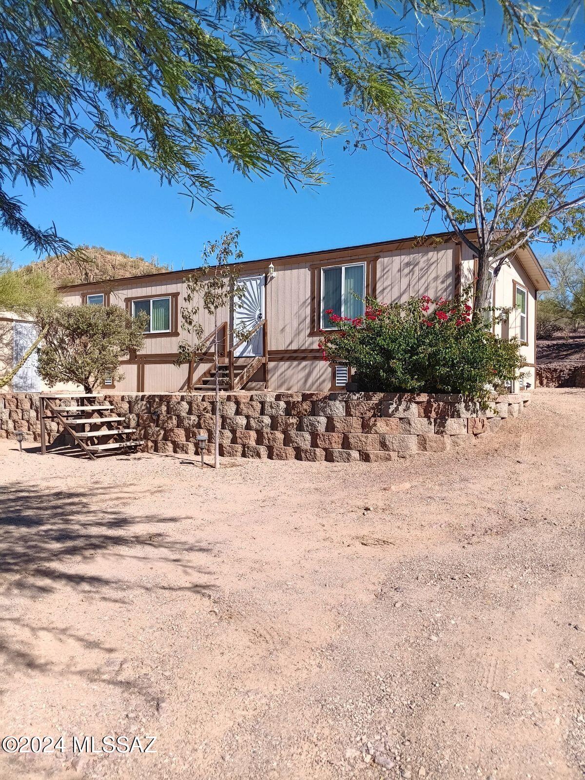 Escape to mountain tranquility with this charming 2 bed, 2 bath home set on a spacious 1-acre lot. This property offers mountain views that create a peaceful retreat. Inside you'll find a cozy open layout with ample natural light, perfect for entertaining. Each bedroom provides comfort, while the two full baths add convenience. Step outside to enjoy the sweeping desert landscaping, complete with a handy shed for extra storage or hobbies. If your seeking a place to call home, this property combines beauty, comfort and space.