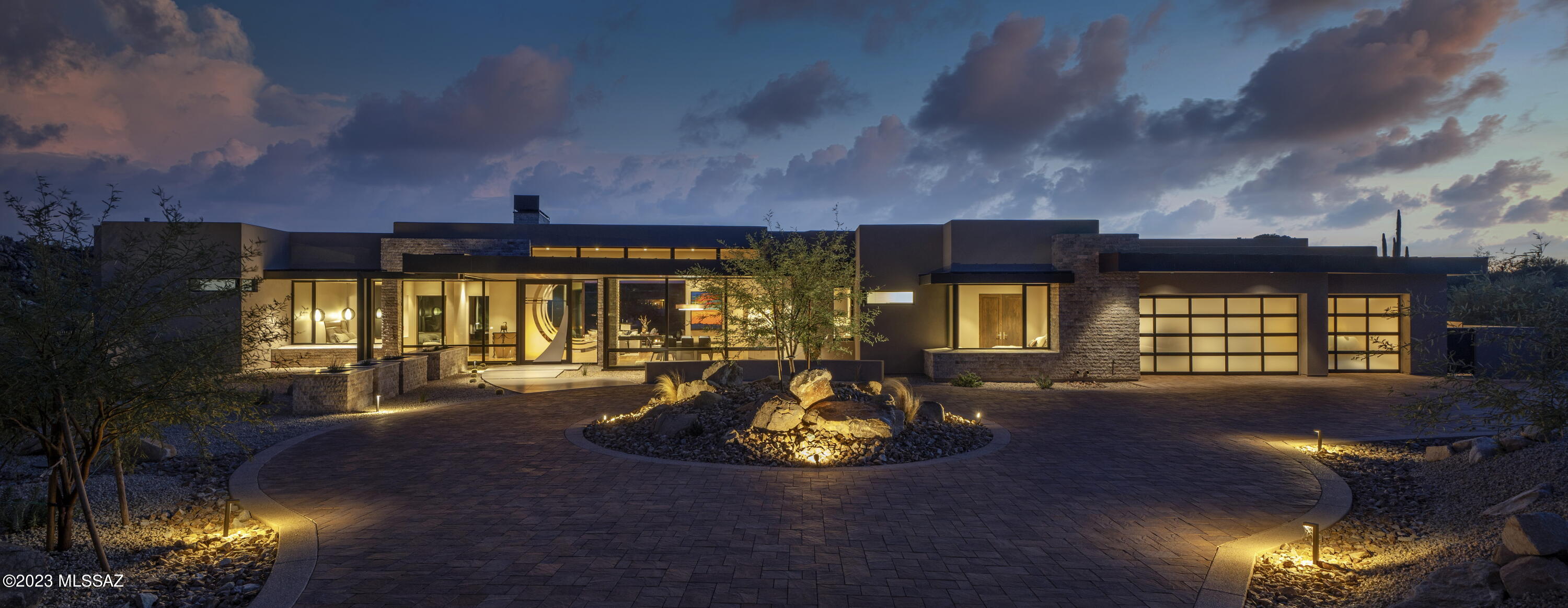 Charming desert modern home has been designed by highly sought-after architect, Marc Soloway, for this golf course lot on 1.119-acres in the exclusive guard gated Stone Canyon.  This single-story home has been thoughtfully designed with floor to ceiling windows to maximize the spectacular views of the Catalina Mountain, rock outcropping and golf course. Enjoy the 4527sqft of open floor plan consisting of 3 spacious ensuites and 5 bathrooms along with an office and den/family room.  The home has been outfitted with luxury in mind from top to bottom.  The chef's kitchen has everything you will need to entertain including a butler's kitchen, two dishwashers two ovens, large refrigerator and separate freezer and over-sized island  Open up the large slider to allow for optimal entertaining space by bring the patio to mesh with the indoor living space. This is a rare opportunity to own a home on the golf course.  Don't let this one slip away.
Stone Canyon offers one of Arizona's best golf courses and has been ranked among top 100 in the nation according to Golf Digest with over 1400-acres of a private master planned golf community. Consisting with endless social activities, Clubhouse, biking and hiking trails and the convenience of the health and Fitness Club offering lap pool, jacuzzi, tennis, pickleball and a large newly renovated gym. Join in with your fellow neighbors in the many social and fitness activities planned throughout each week or schedule your private spa service and enjoy the tranquil surroundings