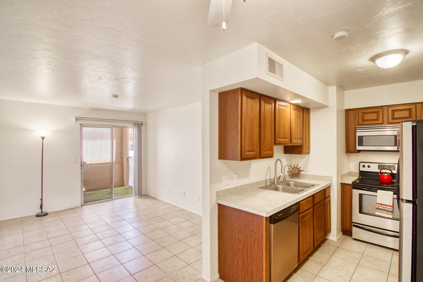 No stairs to climb! Find convenience and comfort with dozens of restaurants within walking distance, shopping, parks, public transit, Banner hospital and the University of Arizona just minutes away.   Ground level condo with stainless steel appliances, 2 bedroom 2 bathrooms with 1 covered parking space. Enjoy resort-style amenities including lrg. pool, lap pool, tennis court, and fitness room, perfect for relaxation and recreation.