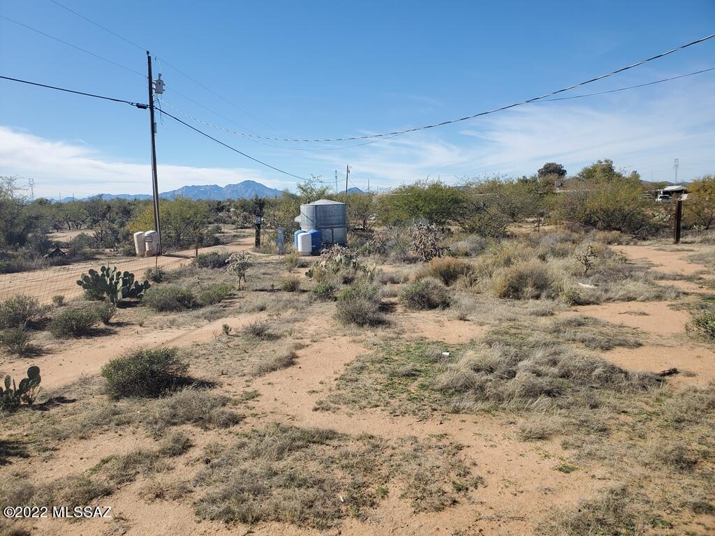 1 acre parcel with water, power, septic installed and impact fees payed (previously had a mobile home but now is vacant). This corner lot is just waiting for your new home (Single detached dwelling, Manufactured or mobile home or trailer, Guest dwelling & Accessory structures). Lot is a short distance from Arizona-Sonoran Desert Museum, Old Tucson, Saguaro National Park and Tucson Mountain Park. Escape the hustle and bustle of the city life. Near fine dining and entertainment, there's Casino of the Sun and Casino Del Sol as well as other fine restaurants, shopping, theaters and concerts, plus you are only 30 min from all the amenities Tucson has to offer. Owner/Agent