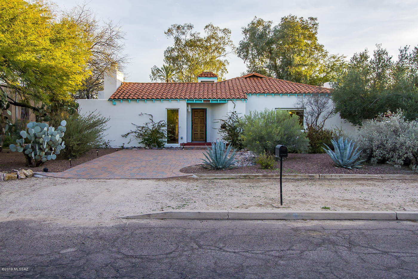 Beautiful centrally located 4BR 2Ba home in the popular Historic Jefferson Park Neighborhood. This Spanish Colonial Revival home was built in 1936 and exquisitely updated and expanded in 2007. This home has been meticulously maintained and the hardwood floors and cove ceilings perfectly compliment the thoughtful must-see updates. The backyard is a peaceful and private oasis, perfect for entertaining, featuring two covered flagstone and brick patios that lend a direct view of the in-ground lap pool and the attached spa in the lush backyard. Coveted off-street parking, as well as a spacious detached 2 car garage with plenty of room for a workshop or extra storage.  All this located within walking distance or easy access to the Streetcar, U of A, Banner Hospital, 4th Ave. and Downtown Tucson