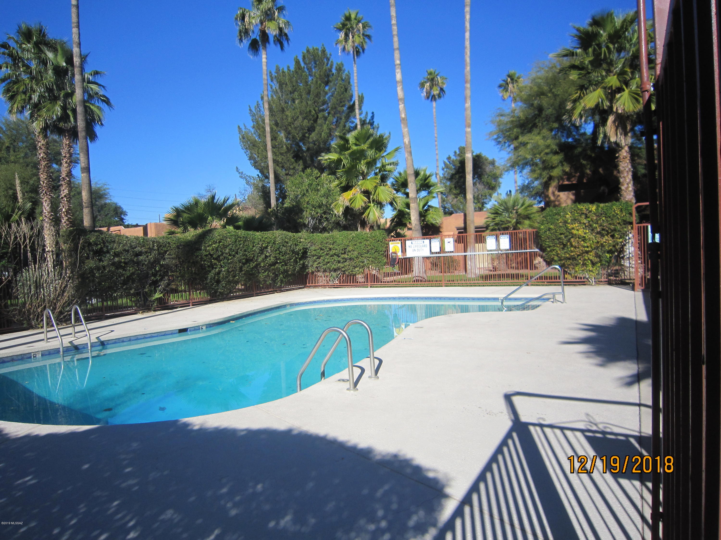 2 Story 2BR 2BA condo with Tile Wood flooring throughout. All Kitchen Appliances located in beautifully landscaped community with pool and common areas. Laundry facilities in common areas. Gated community has covered and open parking.