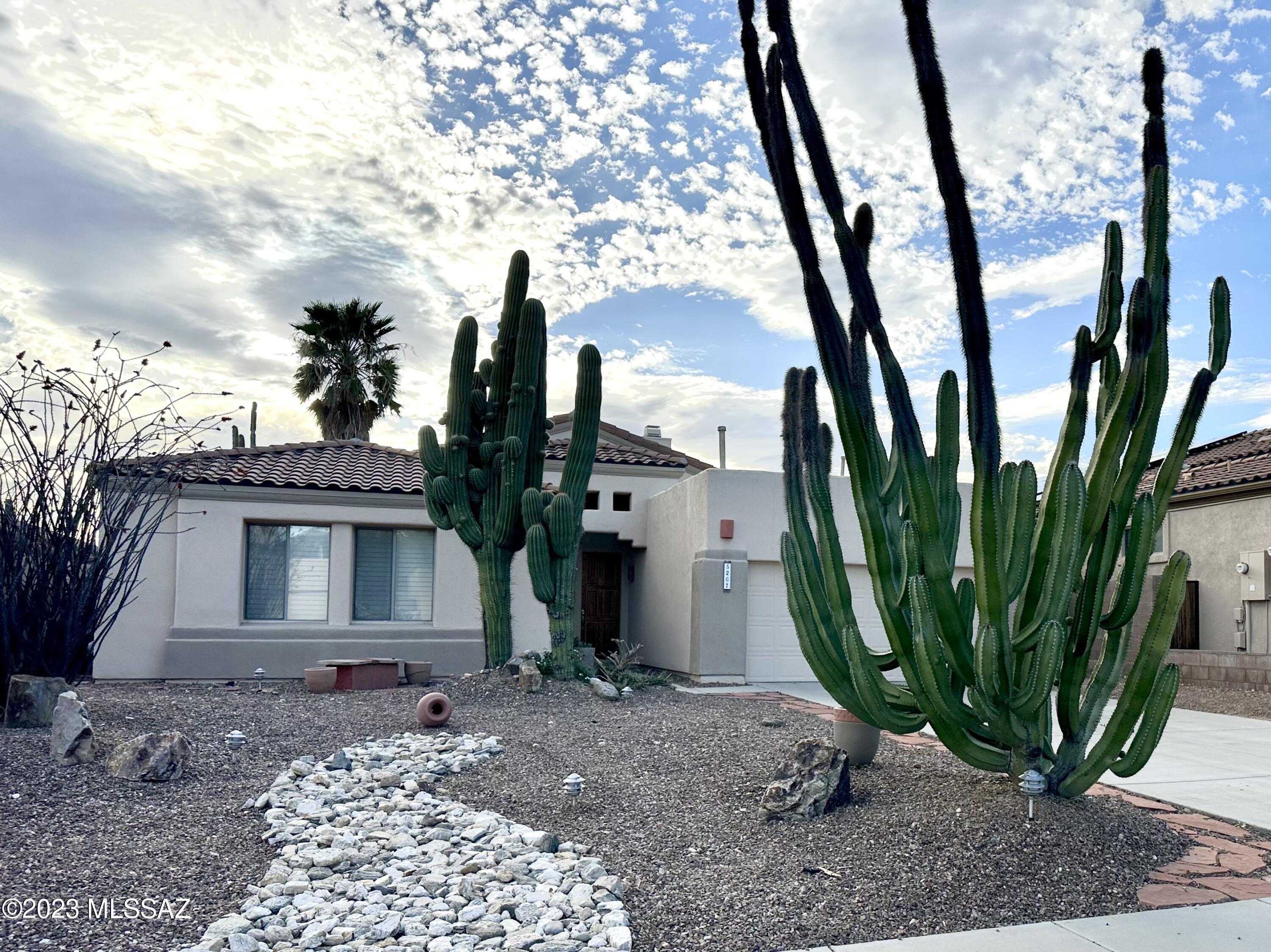 Beautiful home located in the gated community of Sabino Springs. Featuring 4-bedrooms with the primary bedroom split from the other bedrooms, 2-bathrooms, 2-car garage with an extended driveway, exterior paint touch ups, and wonderful community amenities. Enjoy this open floor plan with an eat in kitchen that includes two breakfast bars, formal dining, custom cabinets, stainless steel appliances, electric cooktop, built in microwave, and wall oven. Relax under your covered patio while enjoying the beautiful views of the Catalina Mountains. Enjoy access to Arizona National Golf Club, the community's heated pool and spa, clubhouse, and workout facility. See this home today!