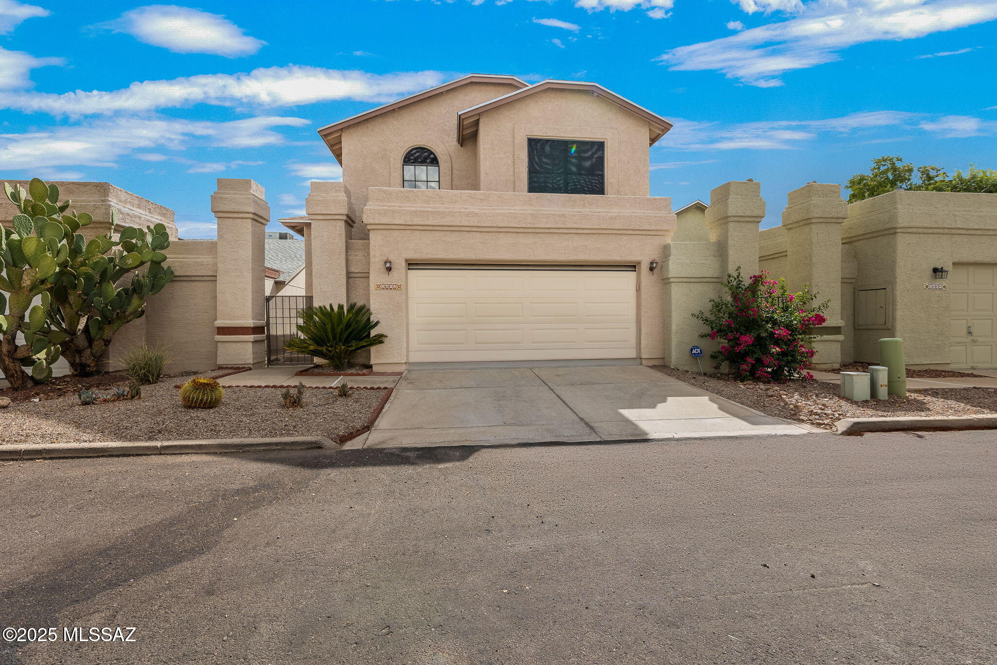 Charming 3 bed, 3 bath home offering 1404 sq. ft. of comfortable living in a quiet subdivision with a true neighborhood feel. Recent updates include new wood-finish flooring, fresh bedroom carpet, & new interior & front exterior paint for a clean move-in ready appeal. Kitchen boasts Travertine tile, refinished cabinets, & brand-new electric range, with all appliances under 5 years old. Step outside to enjoy a gated front yard that flows seamlessly into the backyard, featuring a mister system on the covered patio, cozy fire pit & mature shade trees for year-round enjoyment. The HVAC was recently serviced for peace of mind. Ideally located near everyday conveniences banks, grocery, dining & Tohono Chul botanical garden with Mountain View High School & Legacy Charter in walking distance.