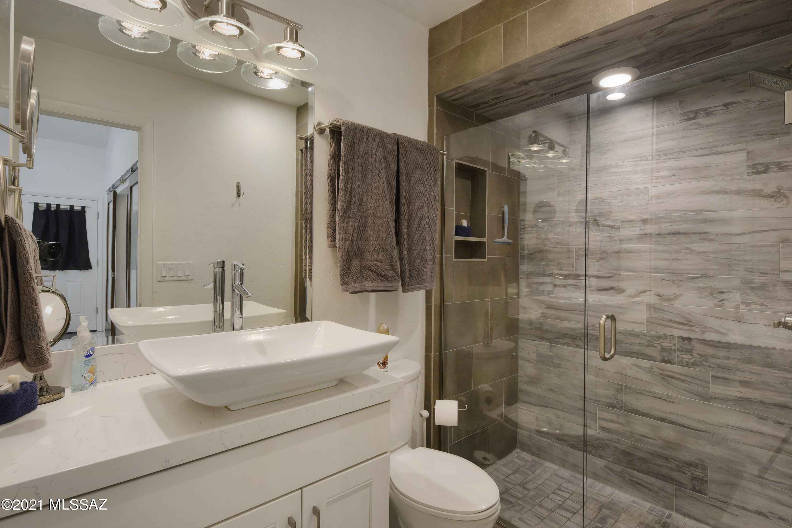 Truly unique condo with A sophisticated contemporary vibration from top to bottom! This unit was stripped down to the studs and remodeled& renovated to the finest detail in 2014. A few finishes include new plumbing,new copper electrical wiring& a newer efficient heating&cooling system. The 20'' tile laid throughout shines with its glossy finish and extends out onto the private balcony that overlooks the pool. Other recent improvements include new windows, plantation shutters, and designer ceiling fans in every room. The vibrant kitchen features Quartz counter tops which are matched in the bathroom. Ladder in bedroom leads to expansive loft space for office/ storage or recreation. Must see to truly appreciate. The unit comes fully furnished! Owner/Agent.