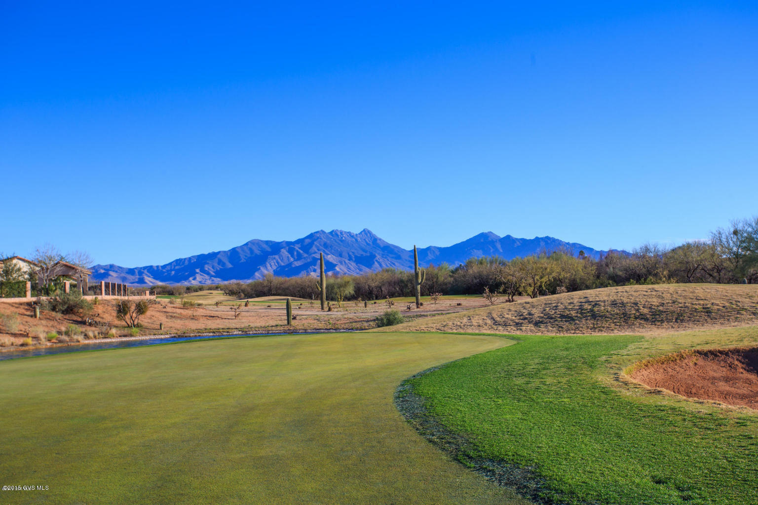 This beautiful home has Panoramic Views of the Santa Rita Mountains and is located on the Roadrunner Golf Course with Lake Views. One of Robson's newest Models, the Medina with a Casita, was built in 2011. The open floor plan is perfect for entertaining family & friends. This distinctive home has an impressive list of features and upgrades. The inviting courtyard welcomes you with a private, cozy gas fire pit and gorgeous views. 2X6 Construction, 2-Car Extended Garage, plus Golf Cart Garage with epoxy floors, Recirculating pump, soft water system and custom garage cabinets. The Great Room has Beautiful hardwood floors, Faux Wood Beams & a Raised Fireplace with Granite Tile Surround. Gourmet Kitchen with Granite Counters & Sink, European Beech Cabinets w/Semi-overlay and Crown Molding.