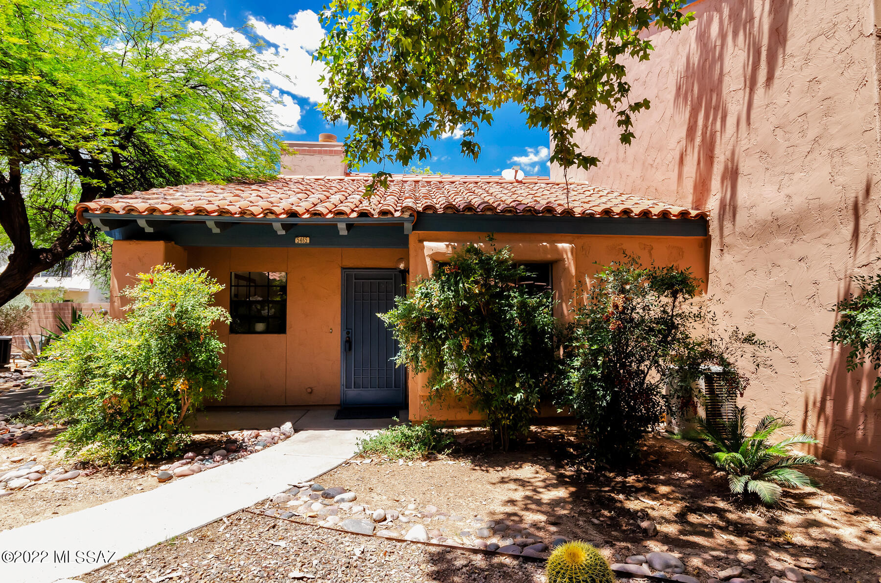 Stylish, comfortable single story townhome! Freshly painted and new carpet. High ceilings, french door, ceiling fans, big windows! The location within the complex is excellent.  An end unit with lots of windows make this bright contemporary plan very desirable.  A covered private patio with good size storage. Beautiful ceramic tile in great room! A new vanity in the owner's suite plus a walk-in closet. Handy built-in closet organizers in second bedroom.  The great room offers a fireplace between it and the dining area.  The kitchen window looks out onto the common grounds. Enjoy this resort style living with 2 pools, tennis courts and stunning grounds to meander around. Convenient location to Sabino Canyon, Basha's shopping center & foothills dining!